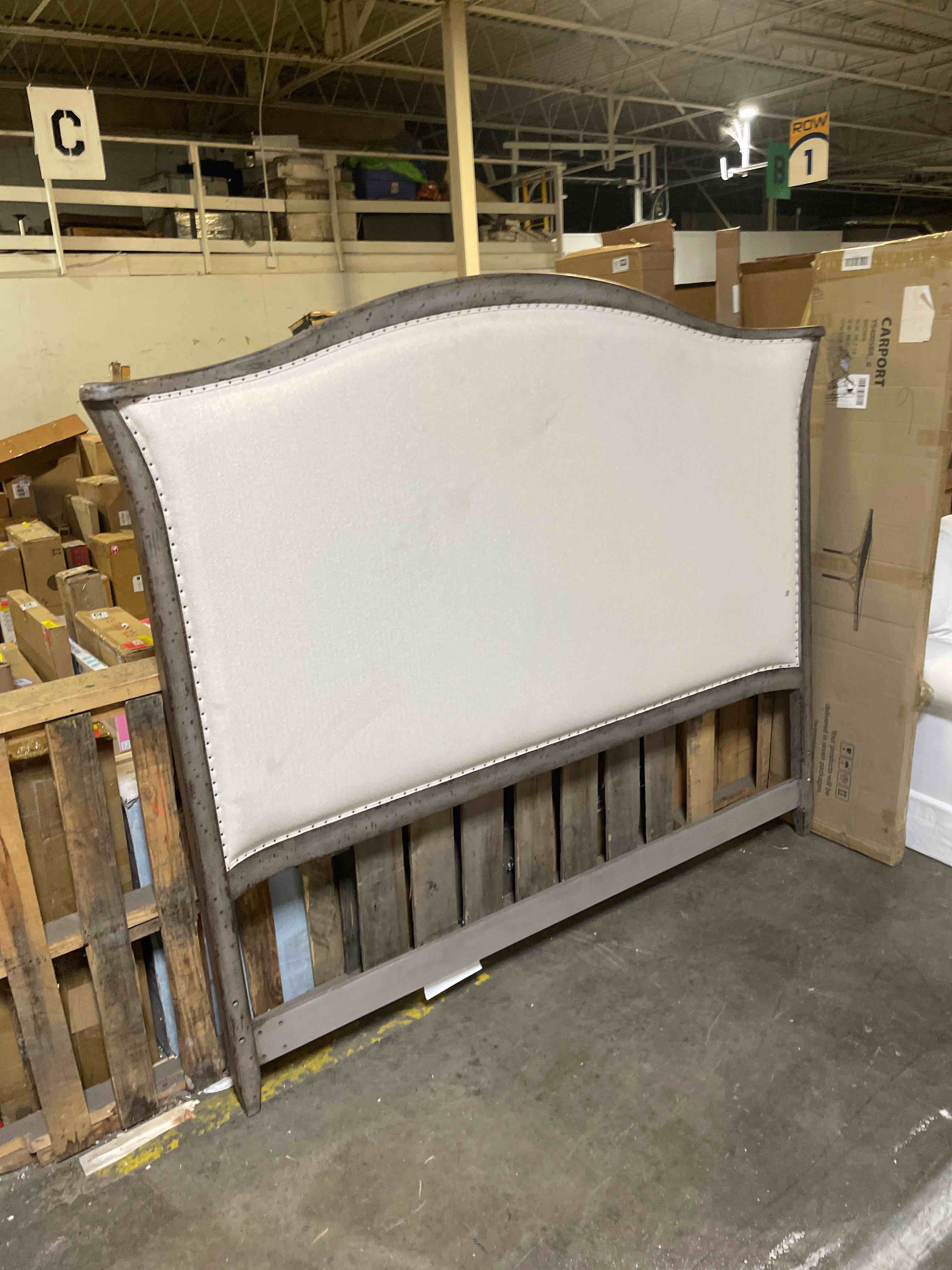 Condition photo showing As Is for bowery hill king upholstered bed, speckled gray finish, poplar solids, creamy tuscan white fabric upholstery, nailhead trim, includes headboard, footboard, and rails, modern bedroom furniture (headboard only)