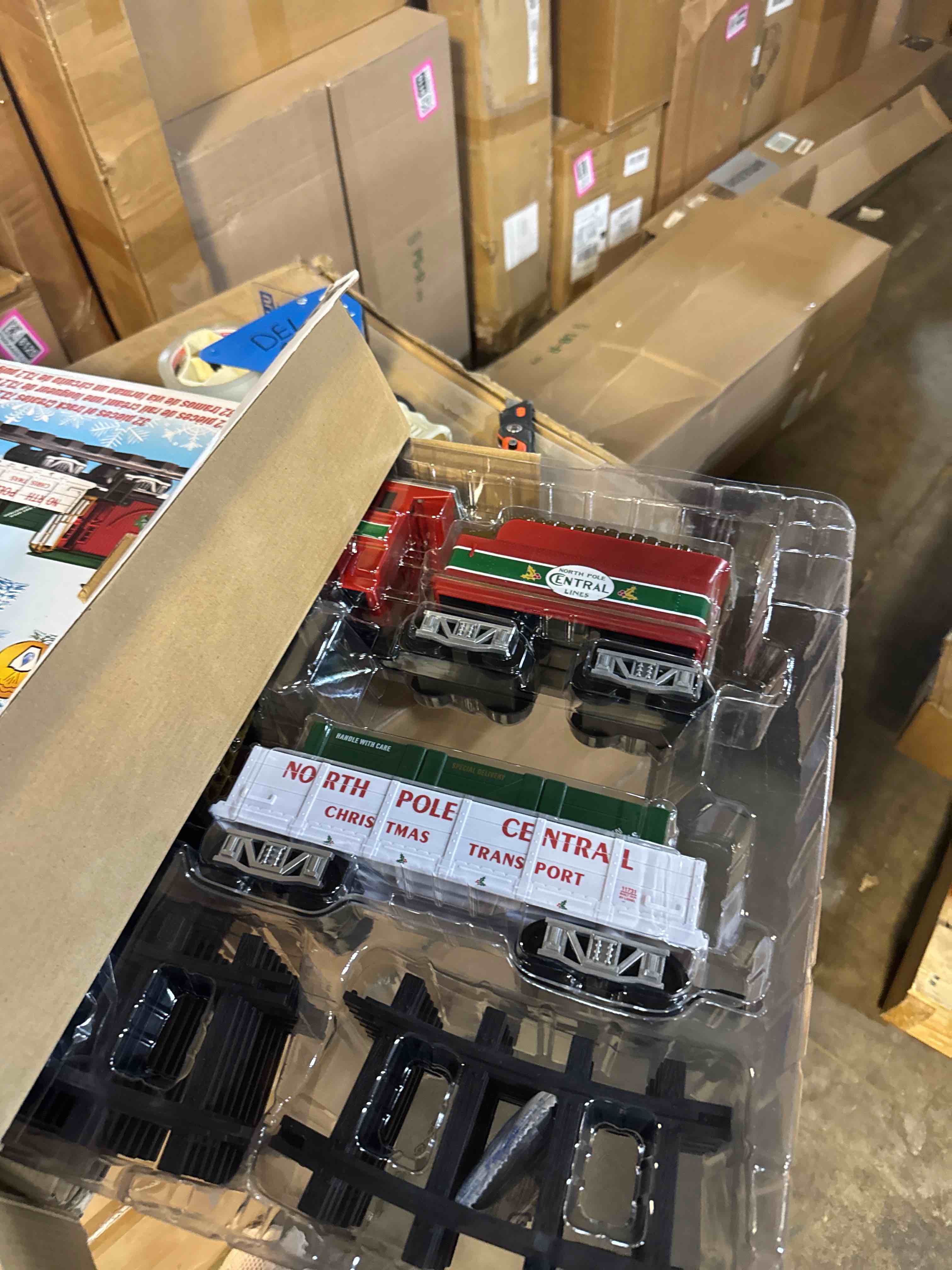 Condition photo showing New/Like New for lionel battery-operated north pole central freight toy train set with bluetooth, locomotive, train cars, & track with authentic train sounds, lights, & water vapor smoke effects for kids 4+