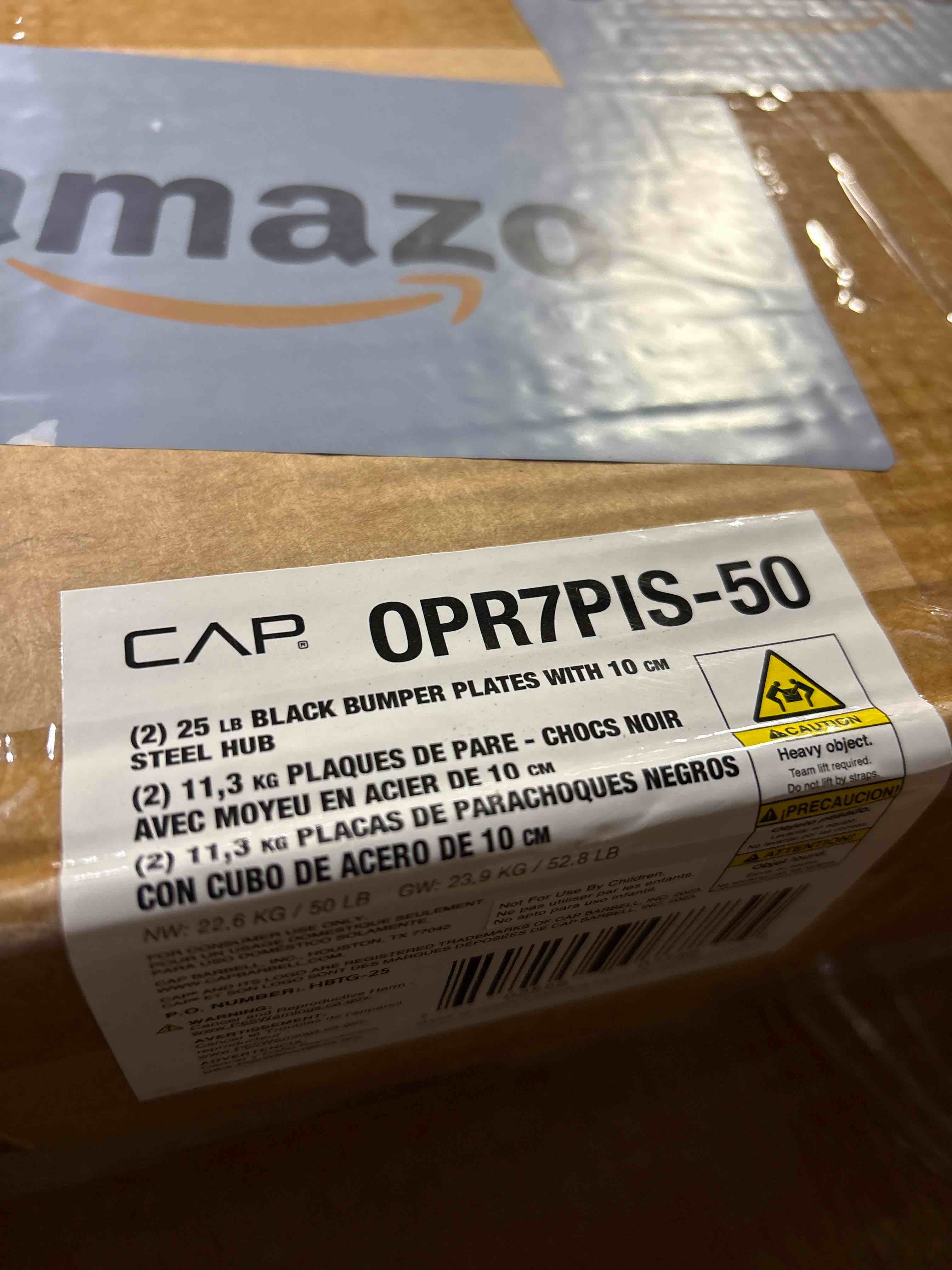 Condition photo showing New/Like New for CAP Barbell Rubber Olympic Bumper Plate | (2) 25lb Black Bumper plates