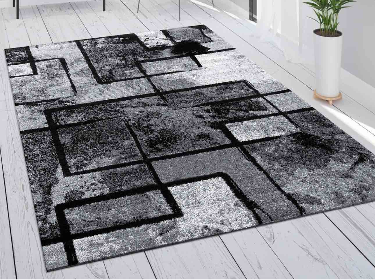 modern black-white area rug with abstract paint effect 7'10" x 11'2"