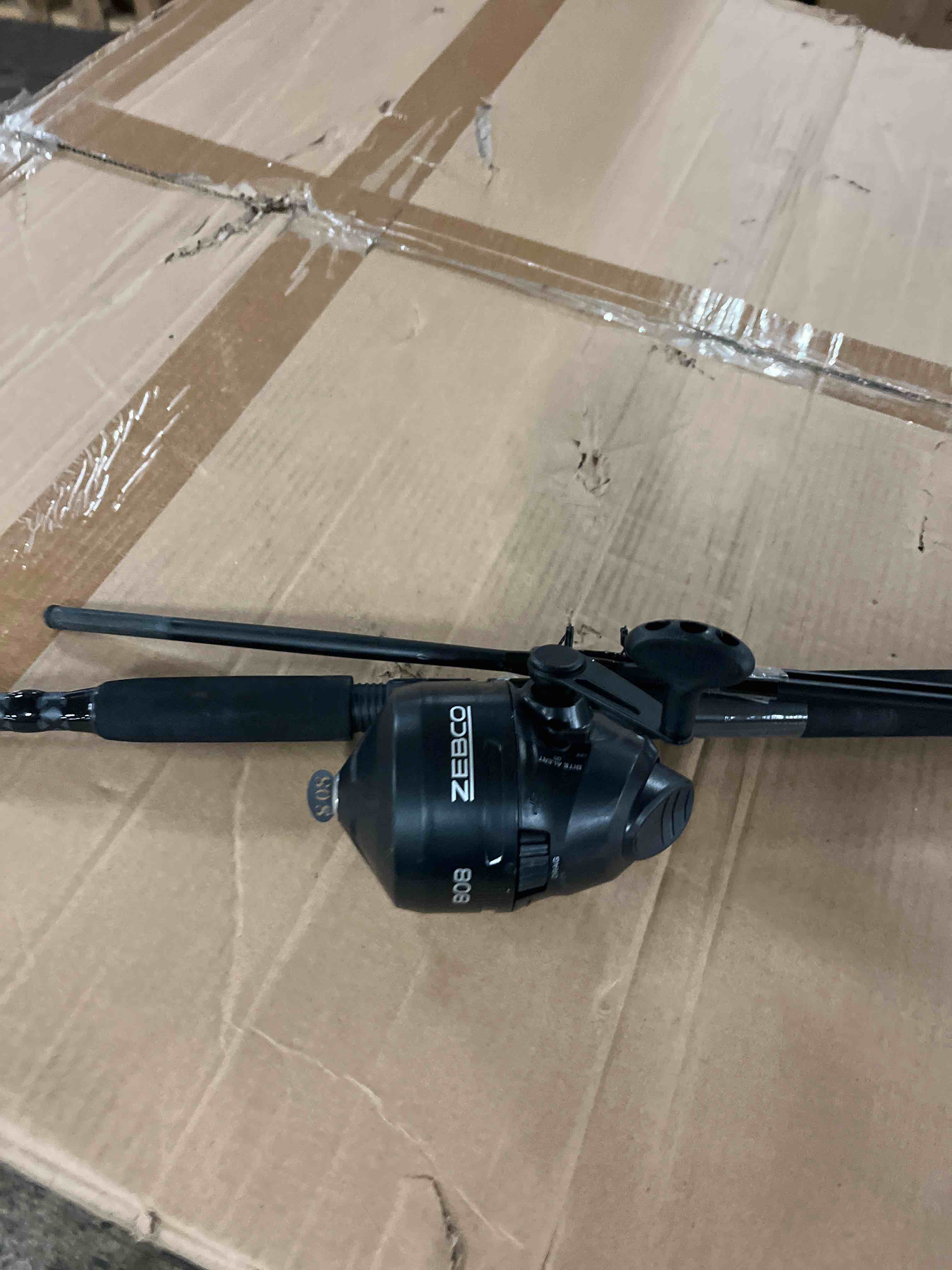 Condition photo showing New/Like New for zebco 808 spincast reel and fishing rod combo, 7-foot durable z-glass rod with extended eva rod handle, quickset anti-reverse with bite alert, pre-spooled with 20-pound cajun fishing line