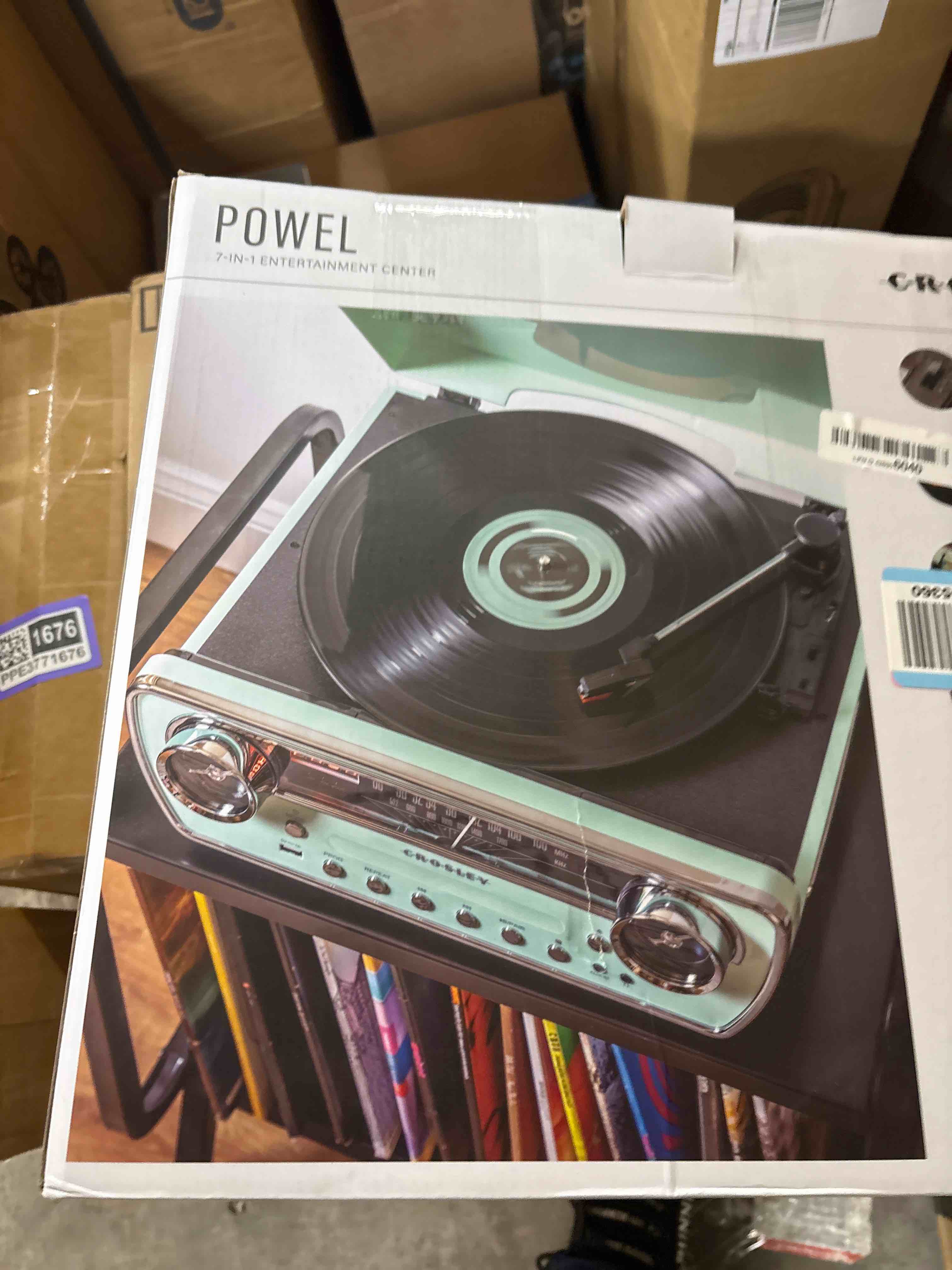 Condition photo showing New/Like New for Crosley CR6047A-AB Powel 7-in-1 Bluetooth in/Out Vinyl Record Player with AM/FM Radio, CD Player, and Aux-in, Aqua Blue
