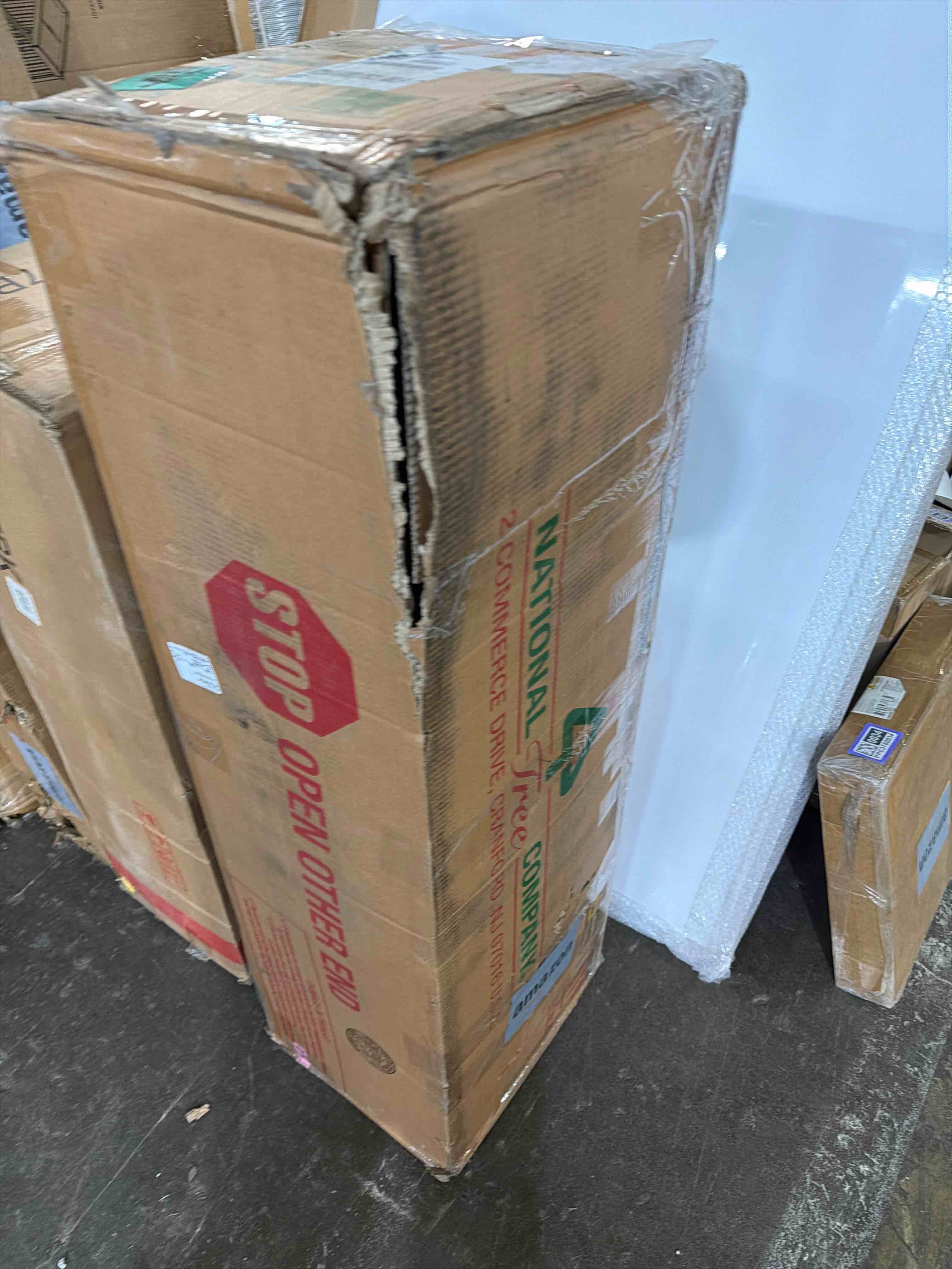 Condition photo showing New/Like New for National Tree Company 7.5 ft Pre-Lit Dunhill Fir Artificial Christmas Tree, 700 LED Lights, 2,514 Tips, Foot Pedal, 10 Light Functions, Includes Stand, Green 7ft 6in Tree