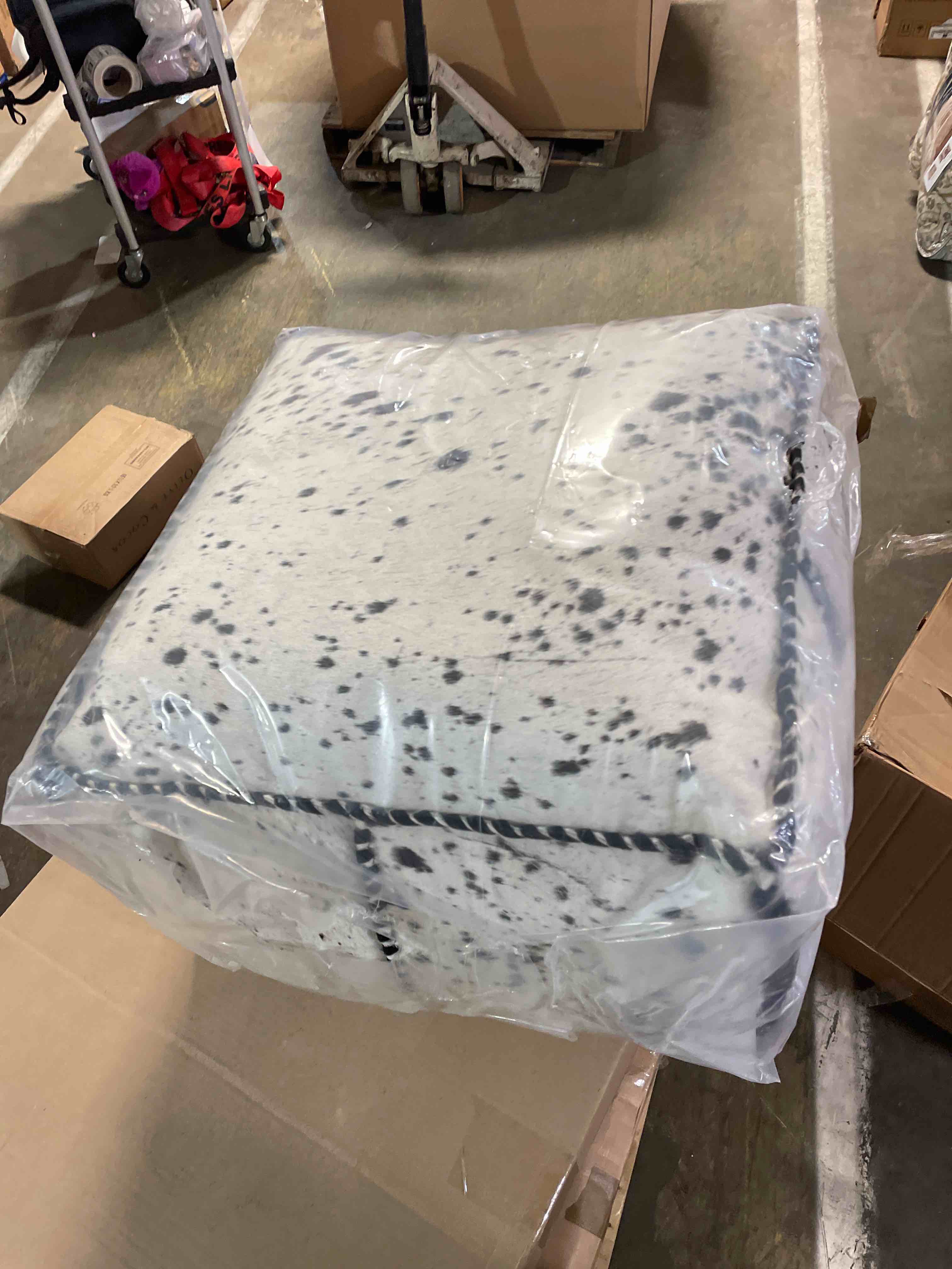 Condition photo showing New/Like New for Rocco Hair on Hide Pouf 