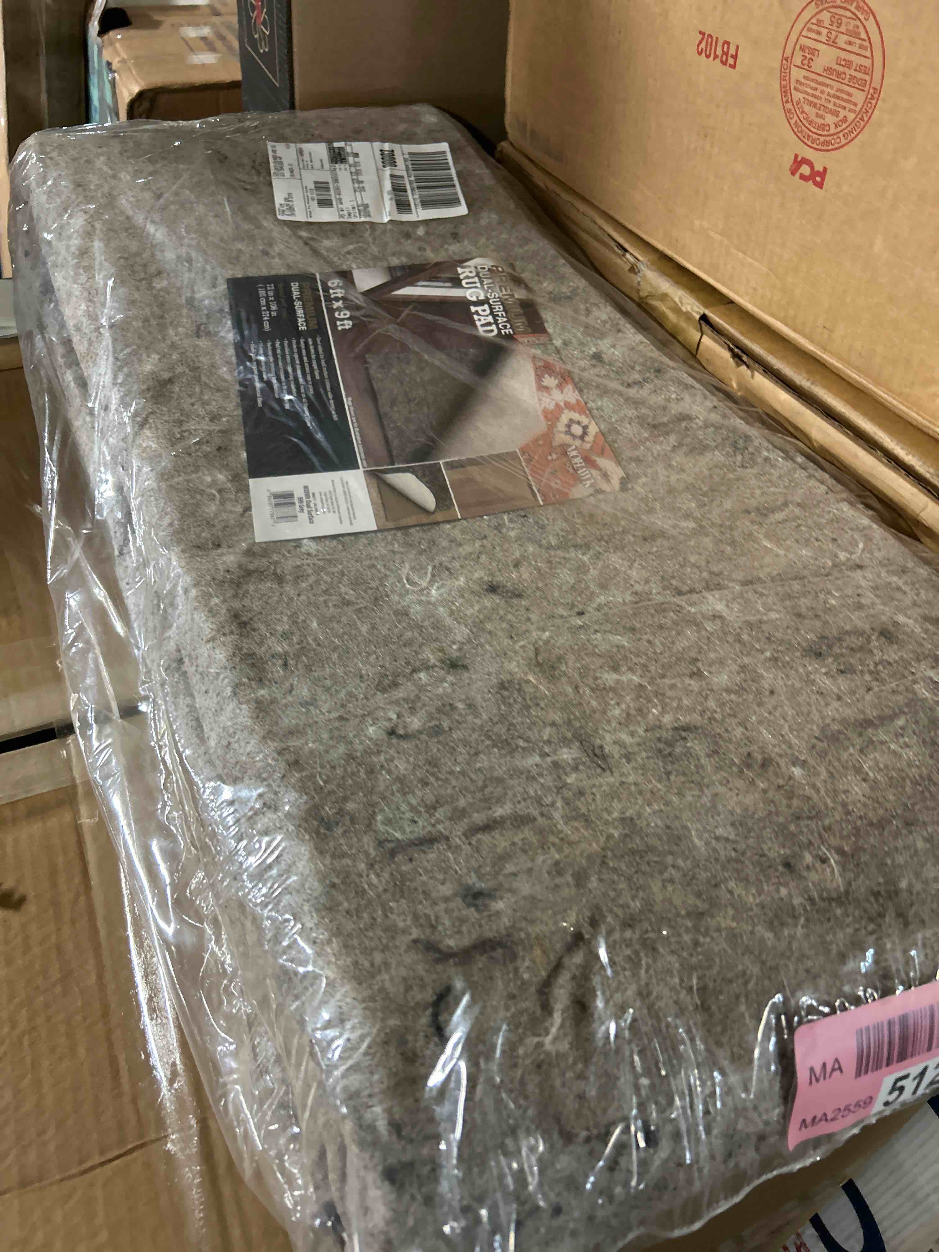 Condition photo showing New/Like New for Mohawk Home 6' x 9' Non Slip Grip Rug Pad 1/4" Thick Dual Surface Felt Cushion + Rubber Gripper - Safe for All Floors 1/4 Inch Dual Surface Rug Pad 6' x 9' (Rectangular)