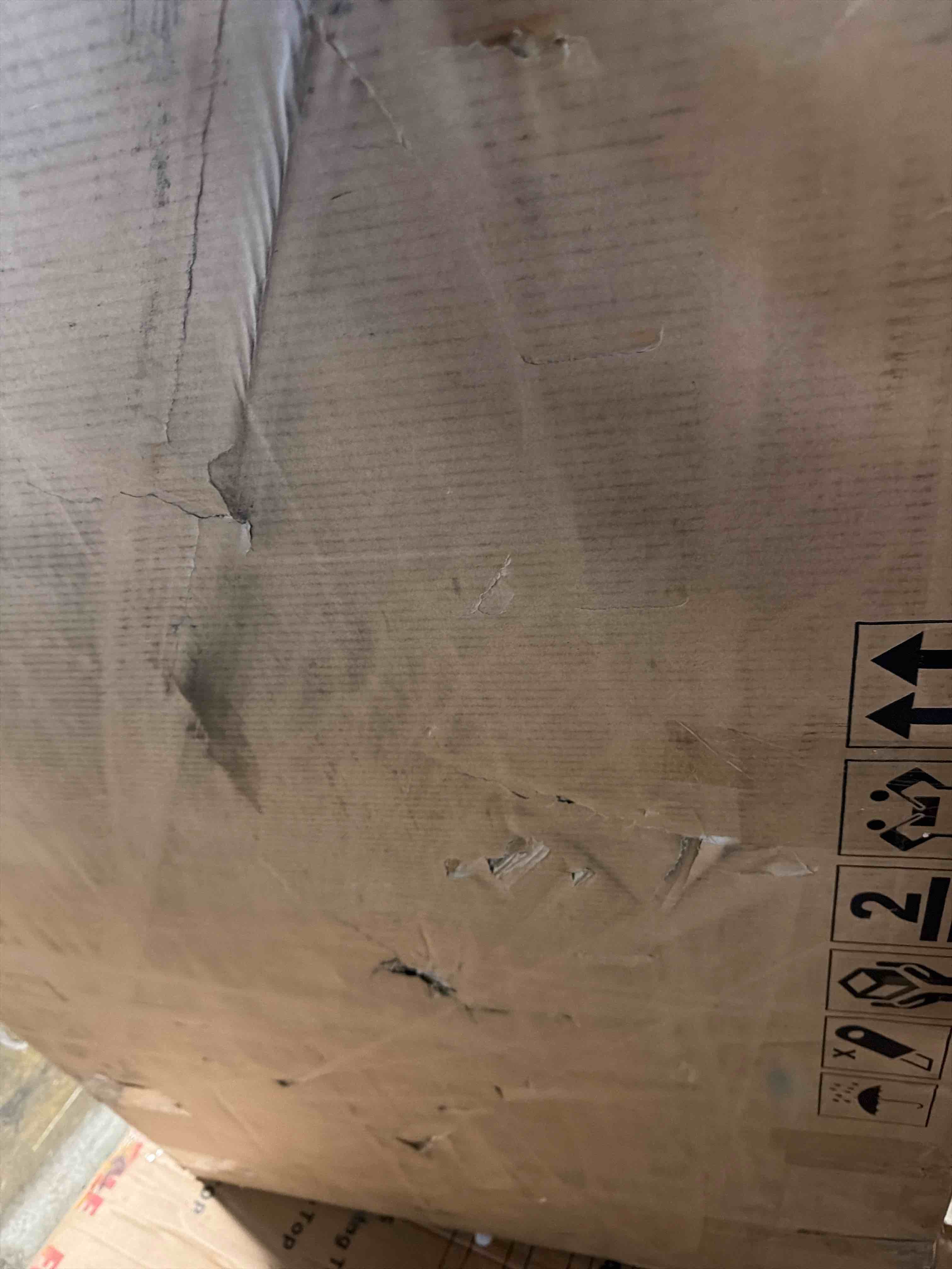 Condition photo showing As Is for Paden 68.5" Coffee Table, Seasoned Brown Acacia by Four Hands