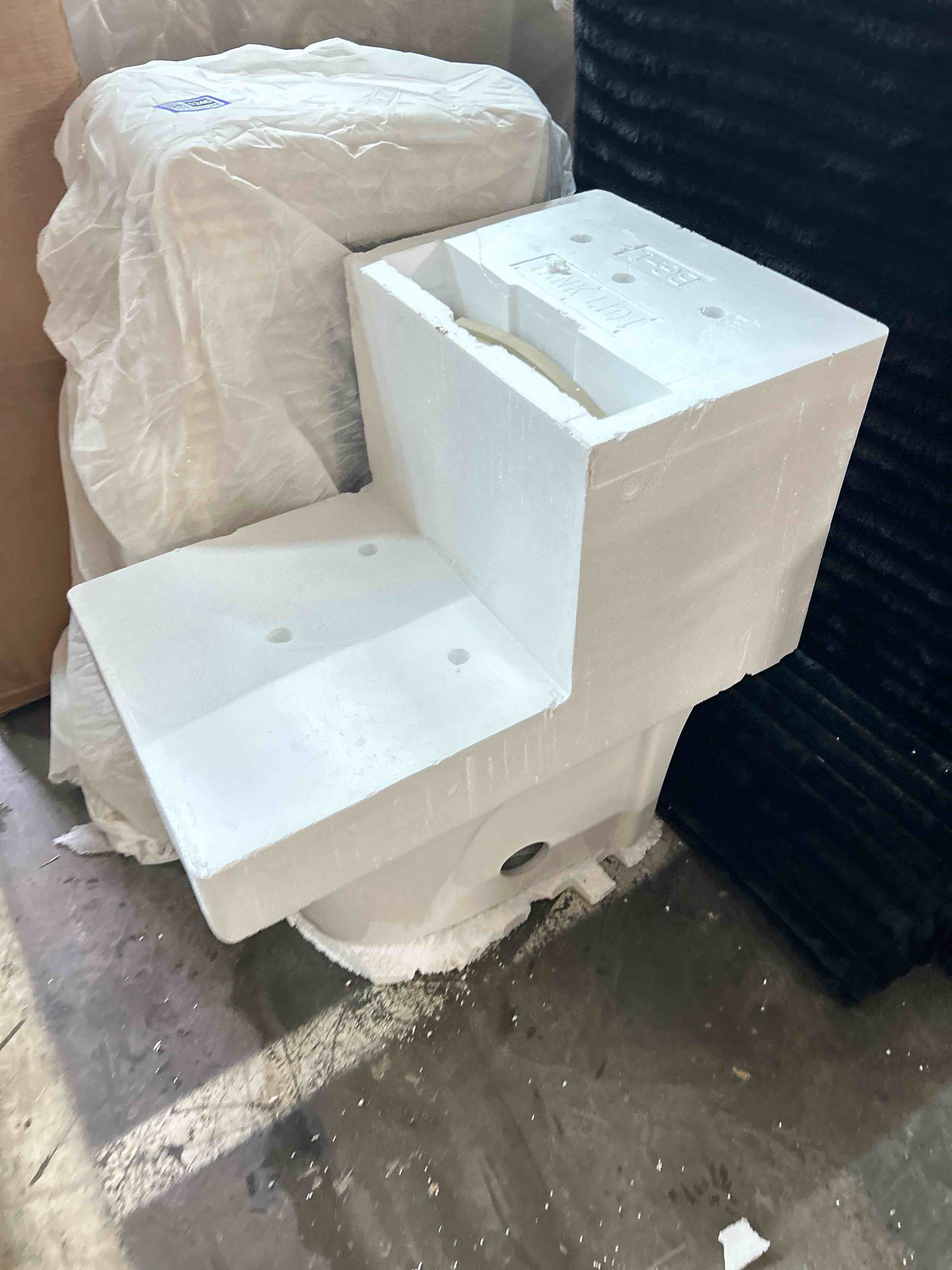 Condition photo showing New/Like New for St. Tropez One-Piece Dual-Flush Elongated Toilet with Black Hardware