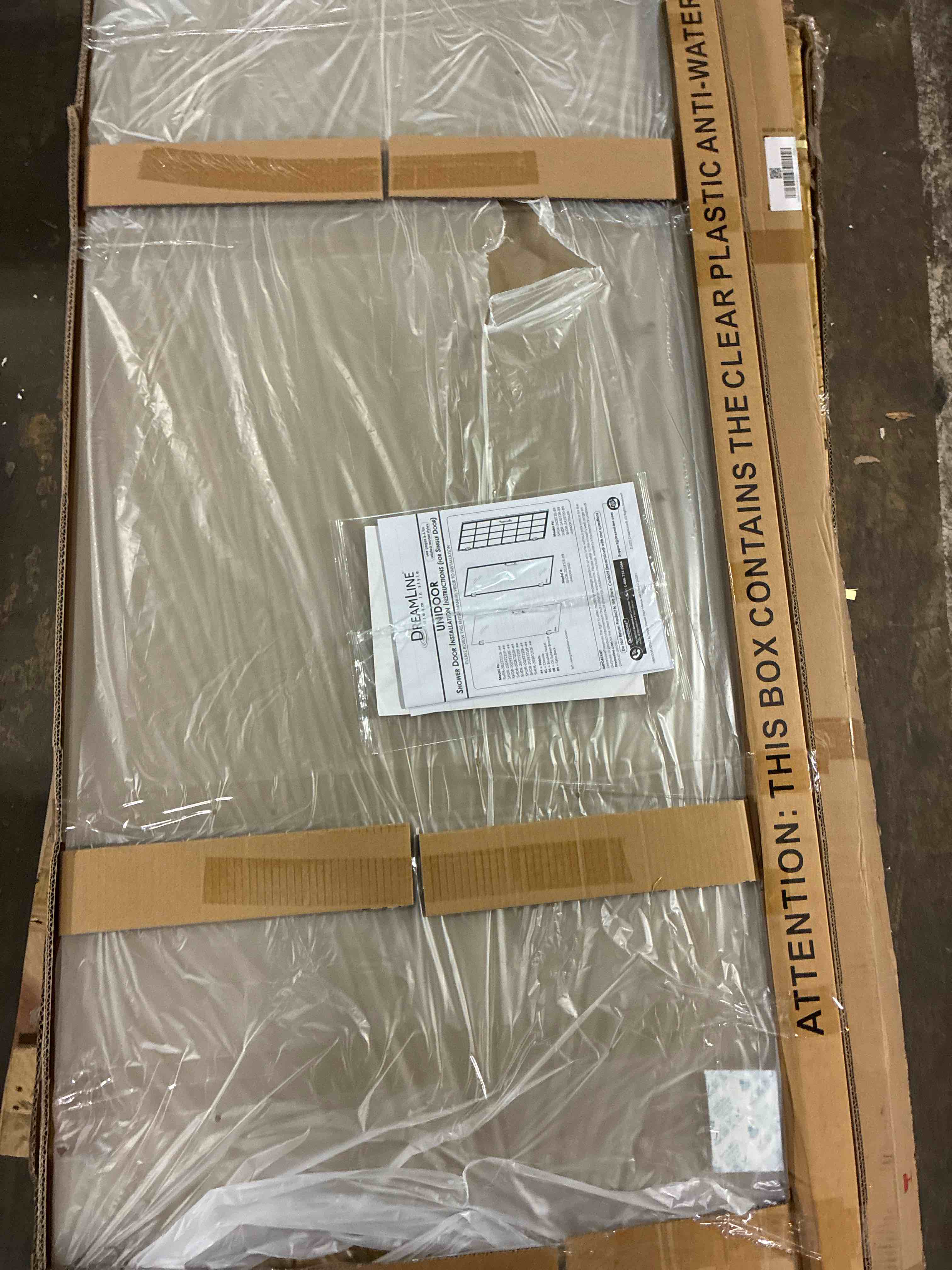 Condition photo showing New/Like New for 28 inch w x 72 inch h frameless hinged unidoor for shower, 2 boxes total