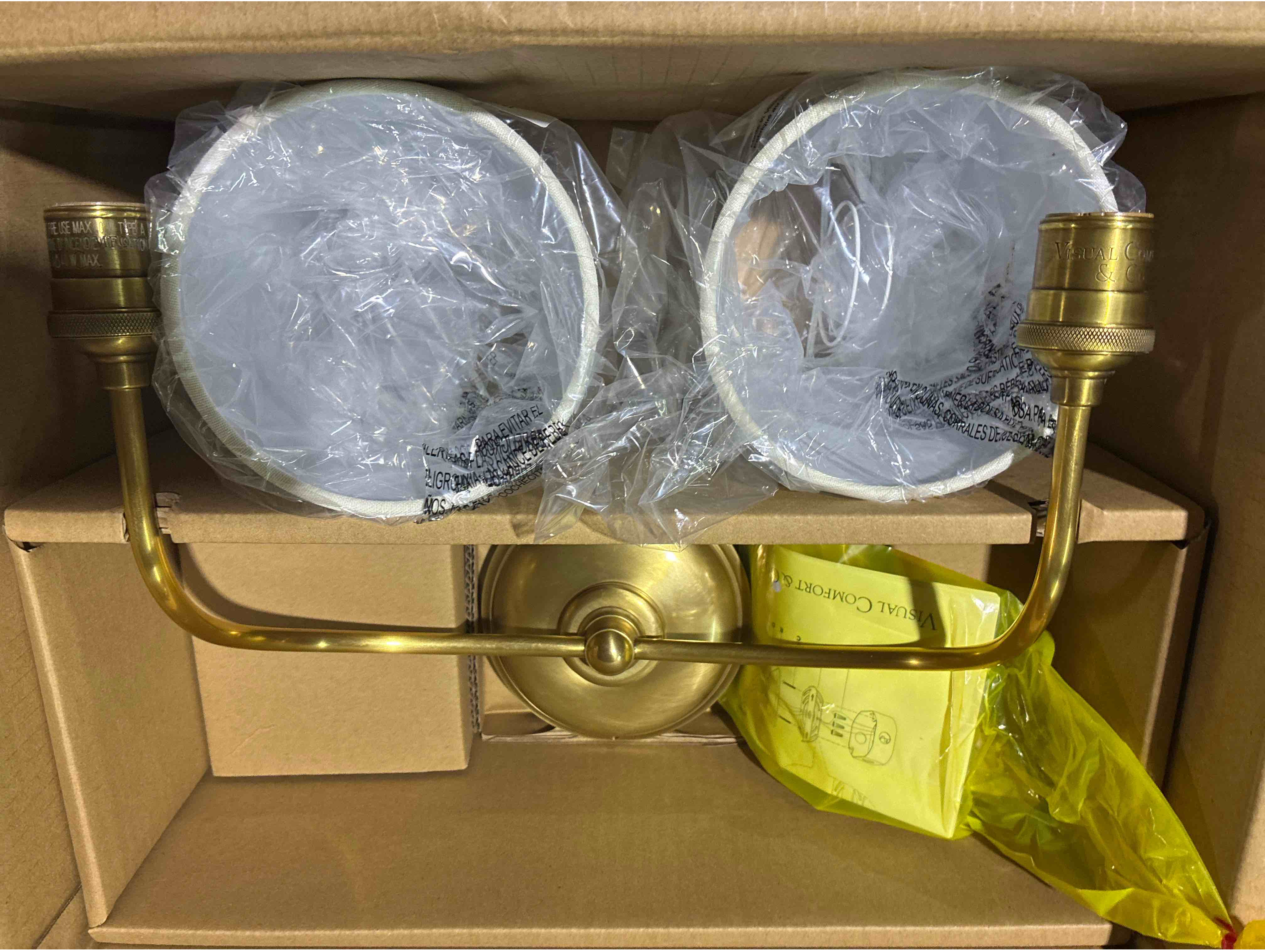 Condition photo showing New/Like New for vendome hand rubbed antique brass double wall sconce with cream linen shades, height: 15.25" width: 17.5" extension: 8.75"