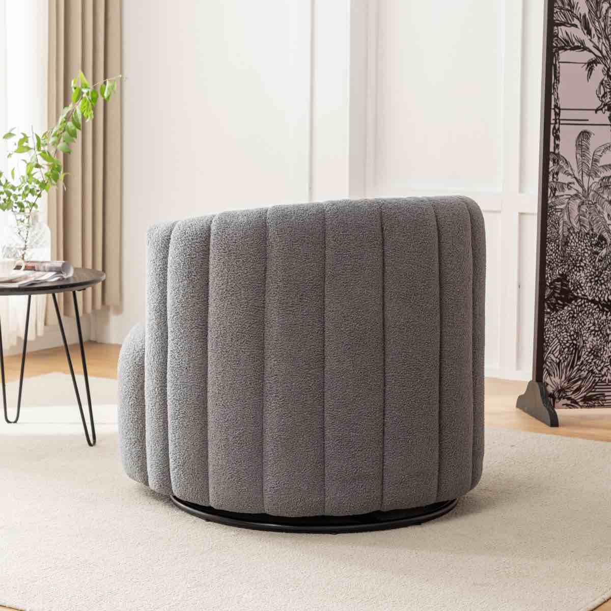 Condition photo showing New/Like New for bryonie upholstered grey teddy fabric swivel barrel chair with line tufted backing. 28 h x 32 w x 30 d