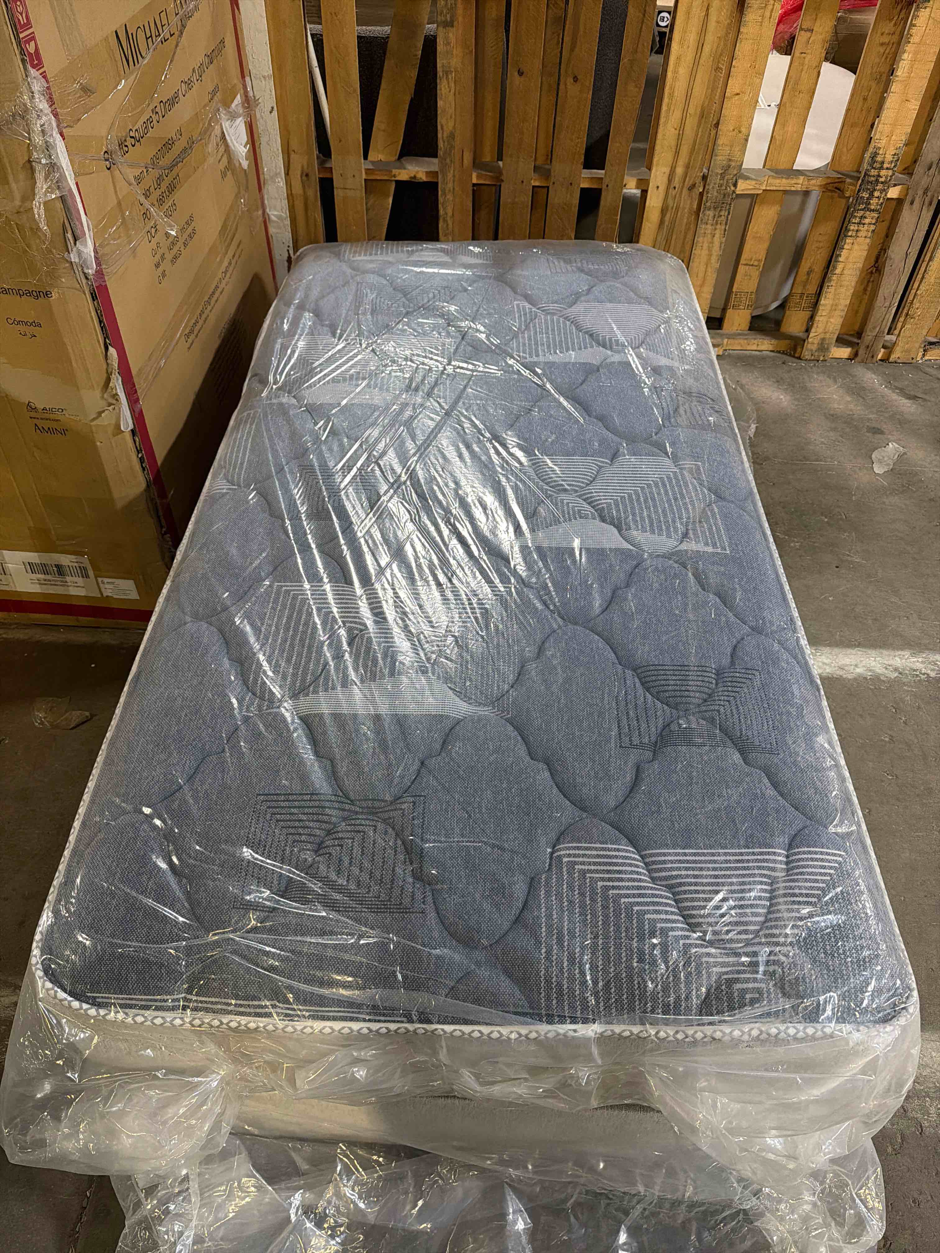 Condition photo showing New/Like New for charlotte beautycoil twin innerspring mattress & matching box spring set – made in usa, grey & white mattress in a quilted comfort surface, compatible with twin bed frames, overall dimensions 38”w x 74”l, corners of box spring have a few very small tears in the fabric(pictured) all are very easily covered