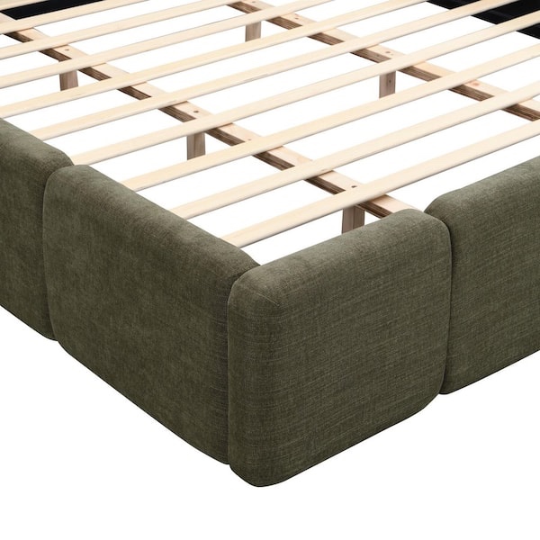 Condition photo showing New/Like New for block style green platform king size bed frame with headboard and footboard, slats & support bars included, along with directions and hardware, (fabric on back side of side rail is slightly torn and is pictured)
