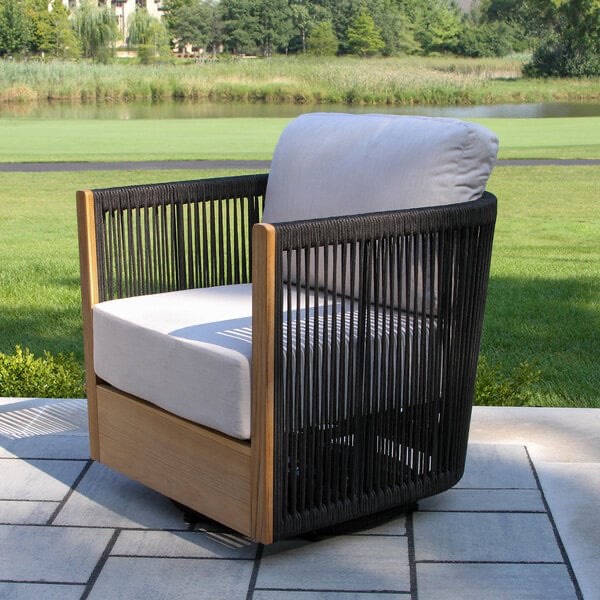 Condition photo showing New/Like New for outdoor interiors black rope and teak swivel chair with sunbrella cushions