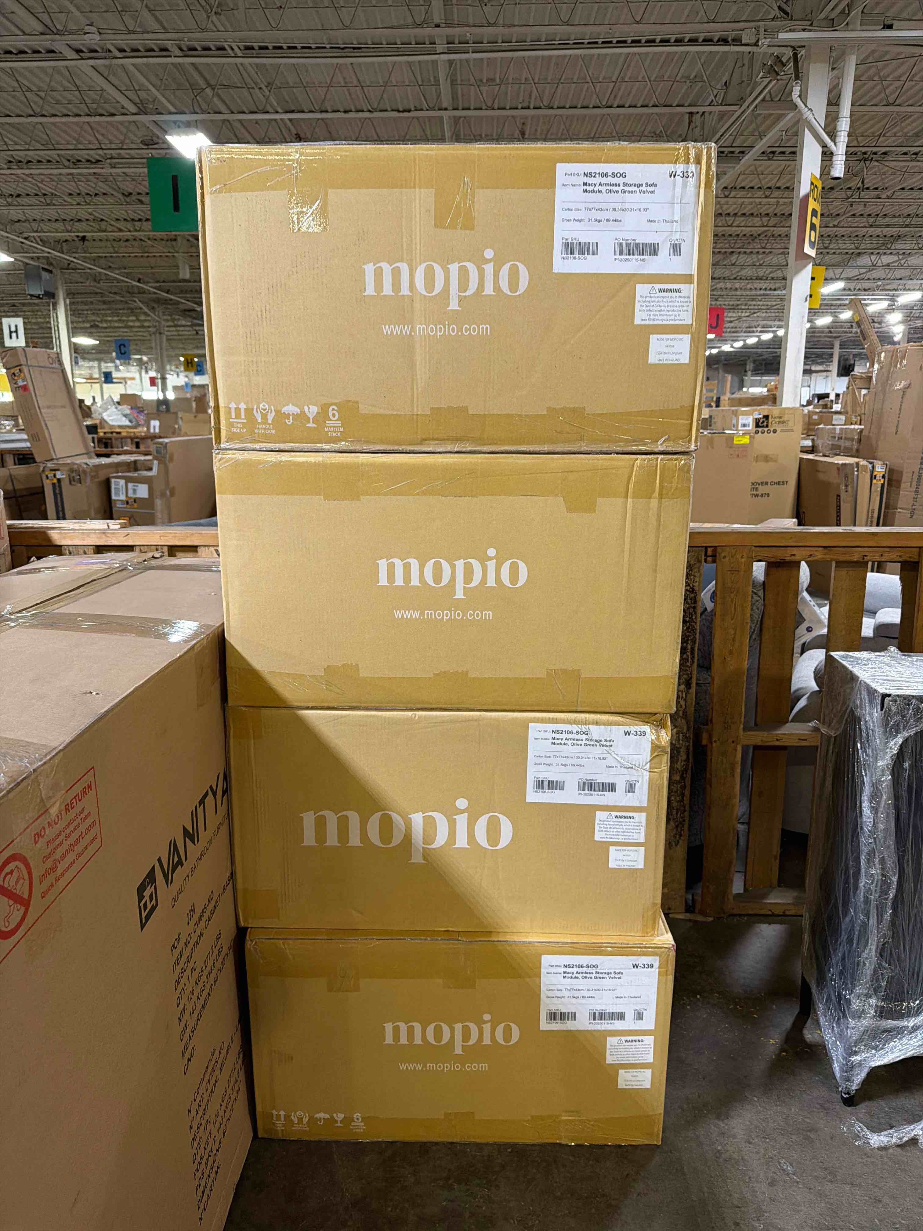 Condition photo showing New/Like New for macy armless 4 piece storage sofa module in olive green velvet, 4 boxes total