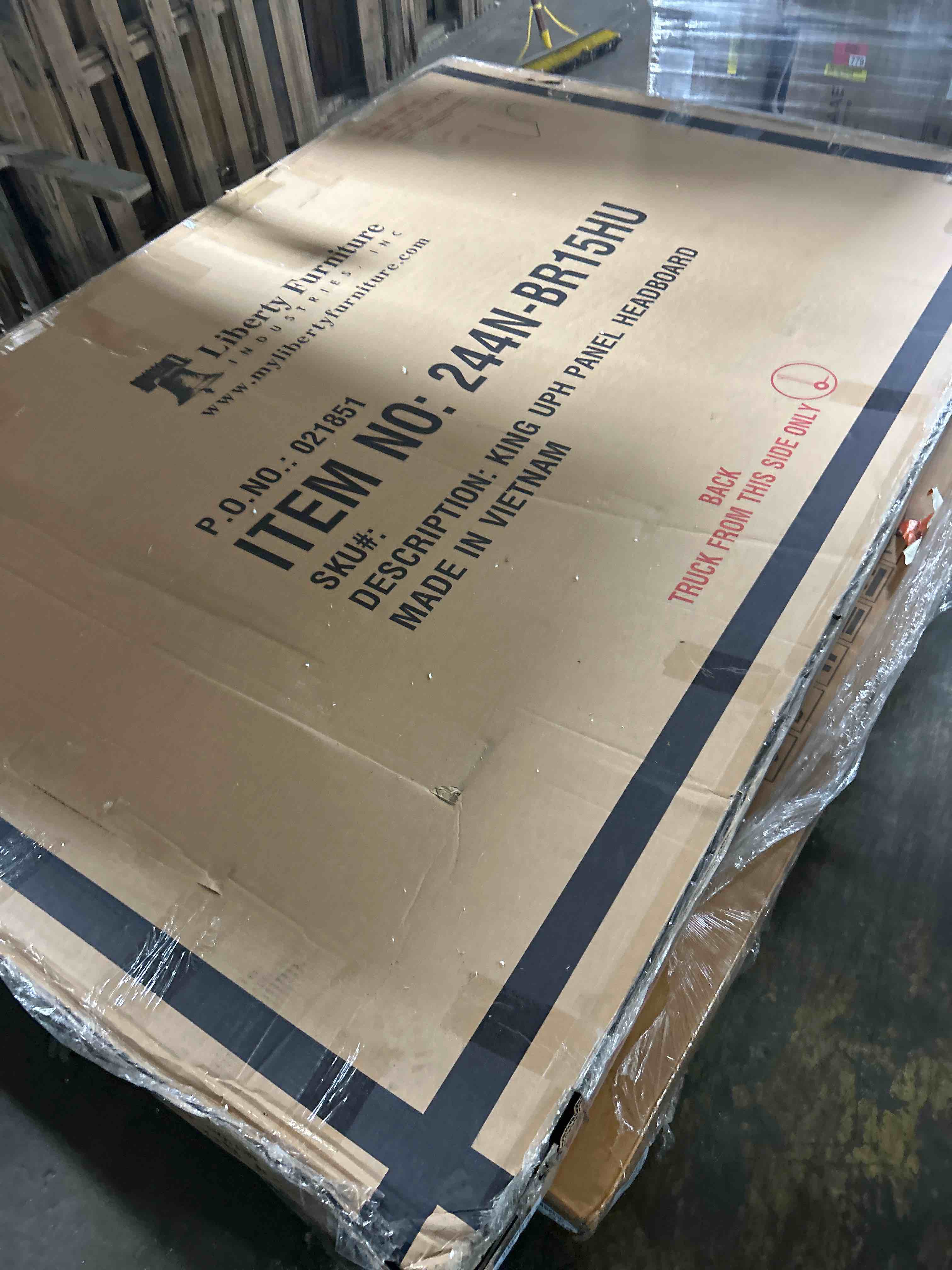 Condition photo showing As Is for liberty furniture magnolia manor ii king upholstered bed  (headboard only)