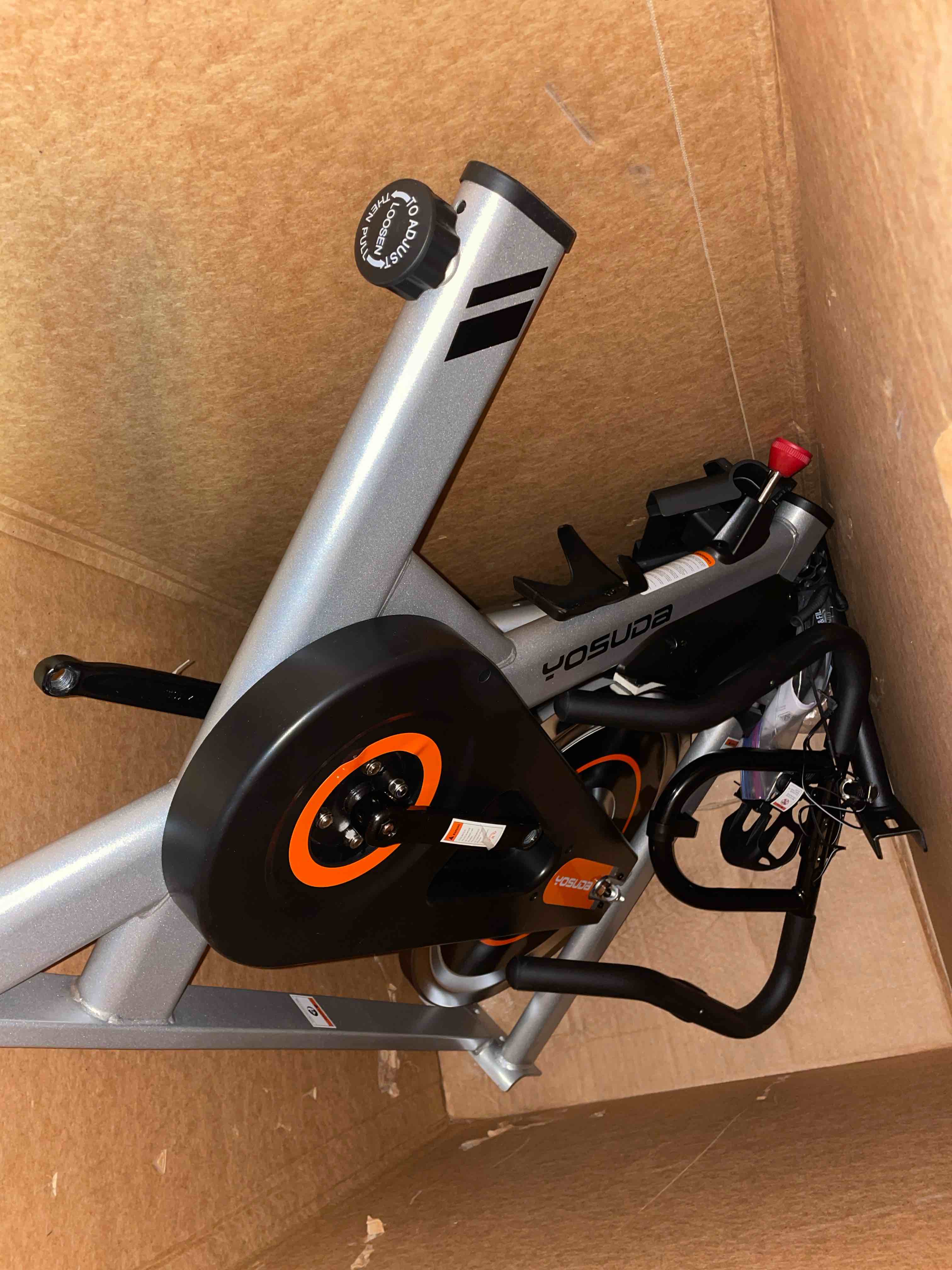 Condition photo showing As Is for yosuda exercise bike, brake pad stationary bike for home with exclusive app, magnetic indoor cycling bike with 300 lb weight capacity, low noise, tablet holder and fitness courses for weight loss