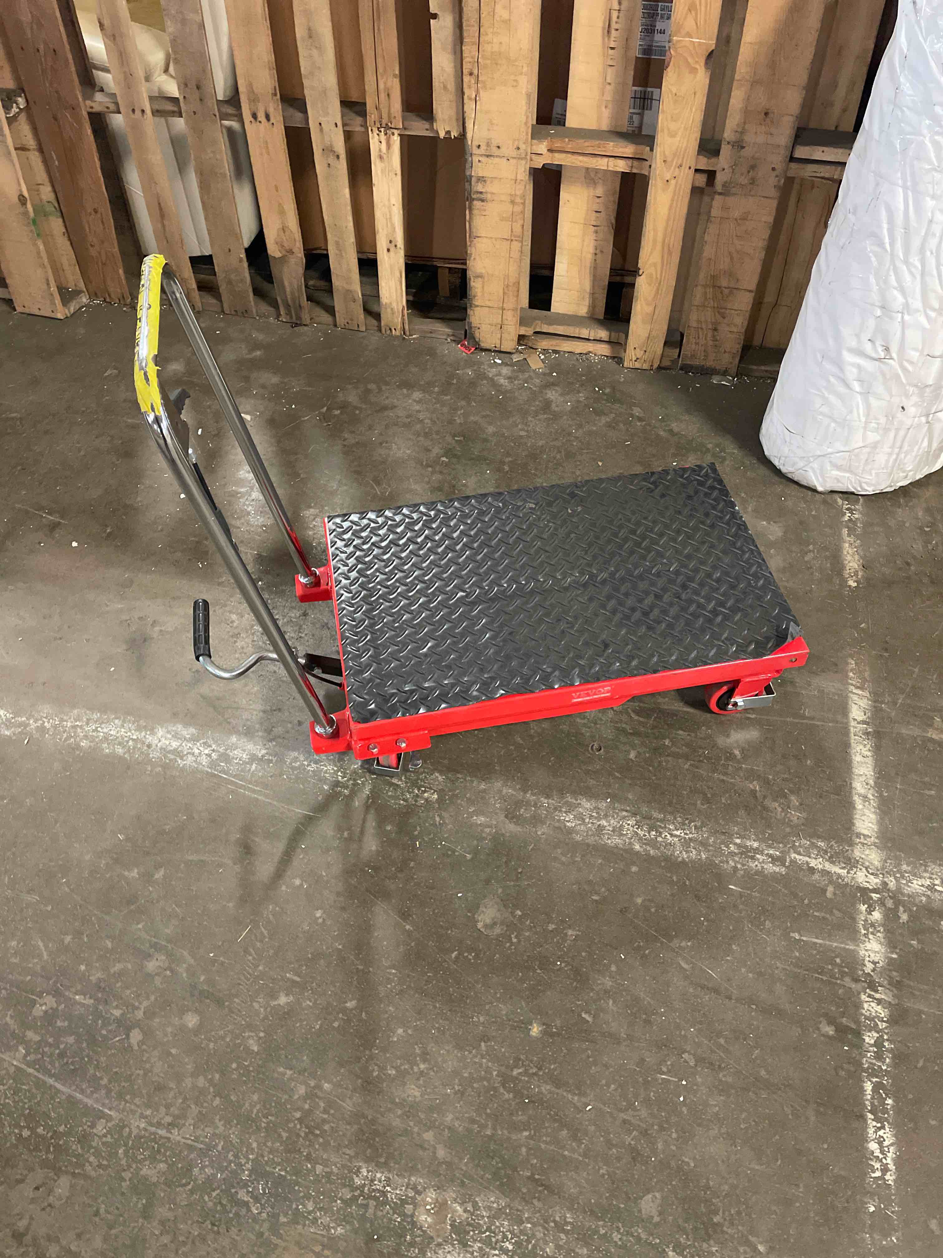 Condition photo showing Good Condition for vevor tf23 hydraulic lift table cart, 500lbs capacity 28.5" with 4 wheels and non-slip pad, for material handling and transportation, red (used)