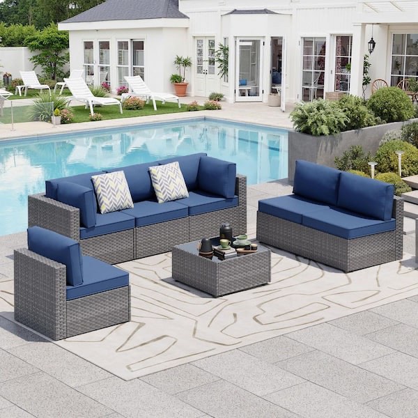 7-piece wicker outdoor sectional sofa set with navy blue cushions (only one seat)