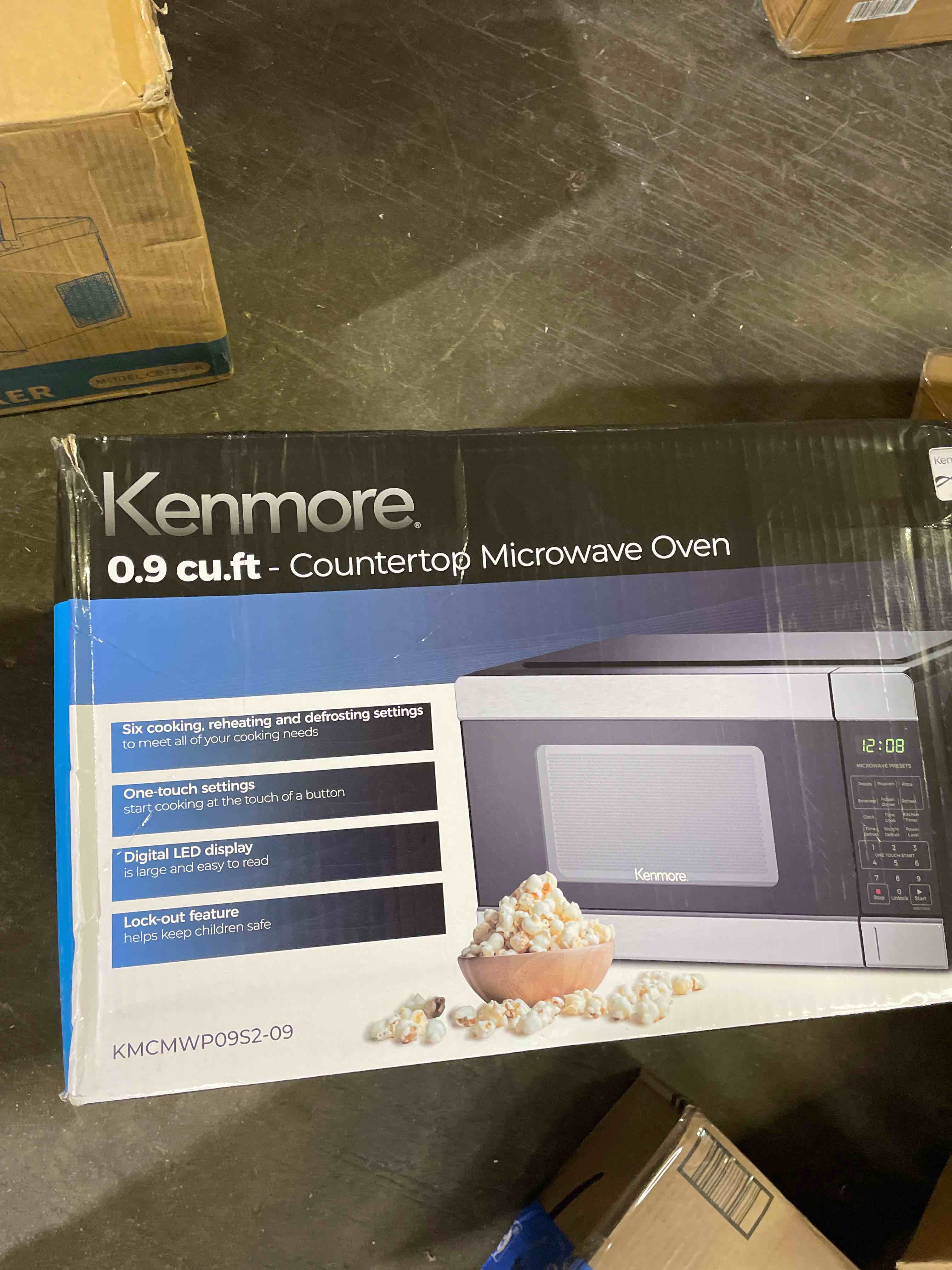 Condition photo showing As Is for kenmore countertop microwave, 6 auto-preset menus, child lock, defrost & express cooking features, 900 watt, .9 cu ft, stainless steel stainless steel 0.9 cu ft (used)