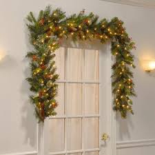 National Tree Company Pre-Lit Artificial Christmas Garland, Green, Wintry Pine, White Lights, Decorated with Pine Cones, Berry Clusters, Plug In, Christmas Collection, 9 Feet