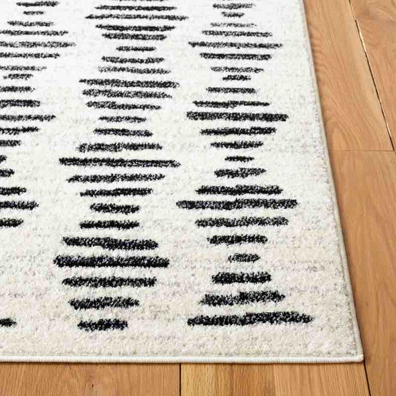 Castonguay Geometric Ivory/Black Area Rug