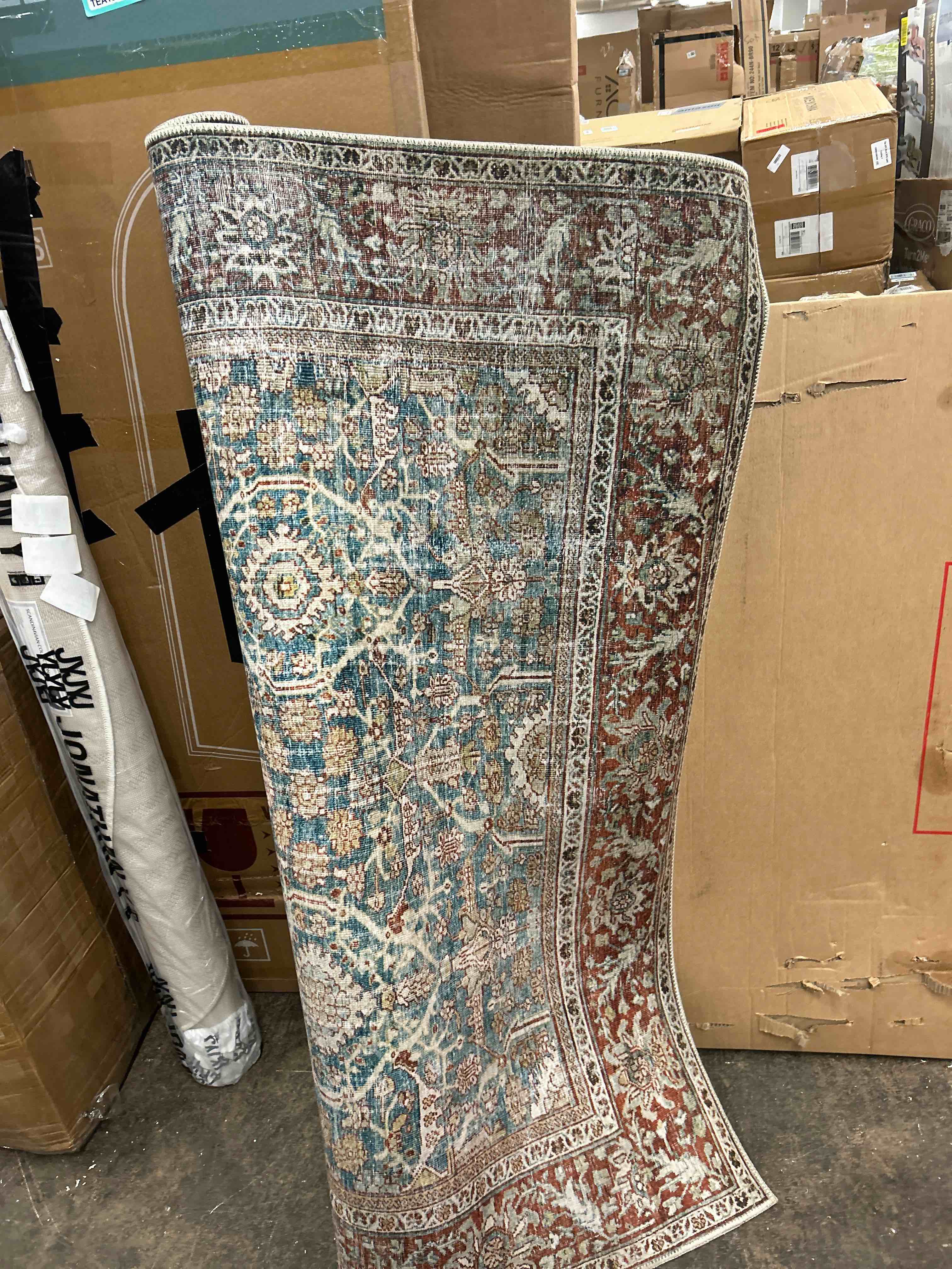 Condition photo showing New/Like New for loloi layla collection lay-04 ocean/rust 7'-6" x 9'-6" .13" thick area rug, soft, durable, vintage inspired, distressed, low pile, non-shedding, easy clean, printed, living room rug