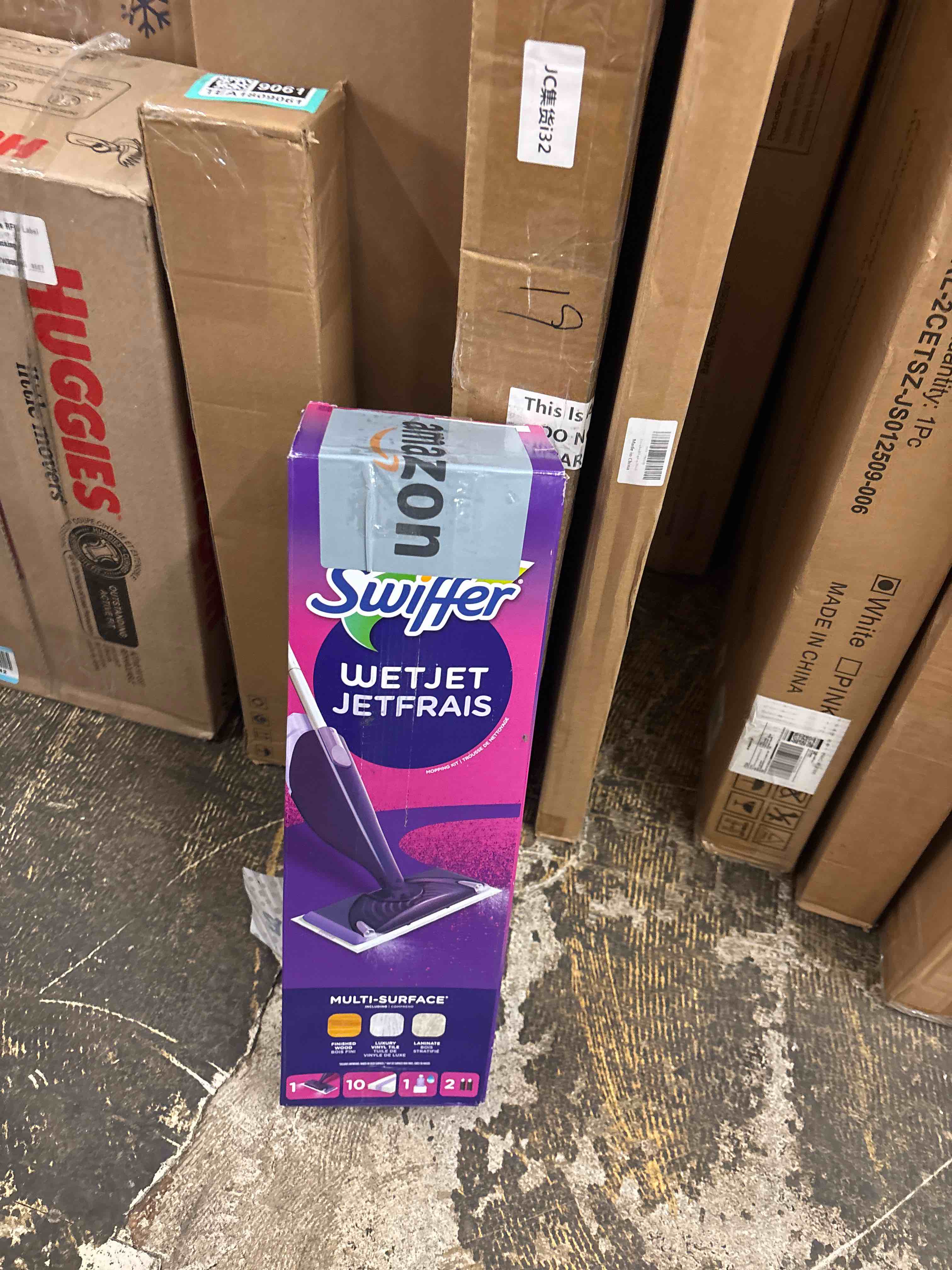 Condition photo showing New/Like New for Swiffer WetJet Hardwood and Floor Spray Mop Cleaner Starter Kit, Includes: 1 Power Mop, 10 Pads, Cleaning Solution, Batteries