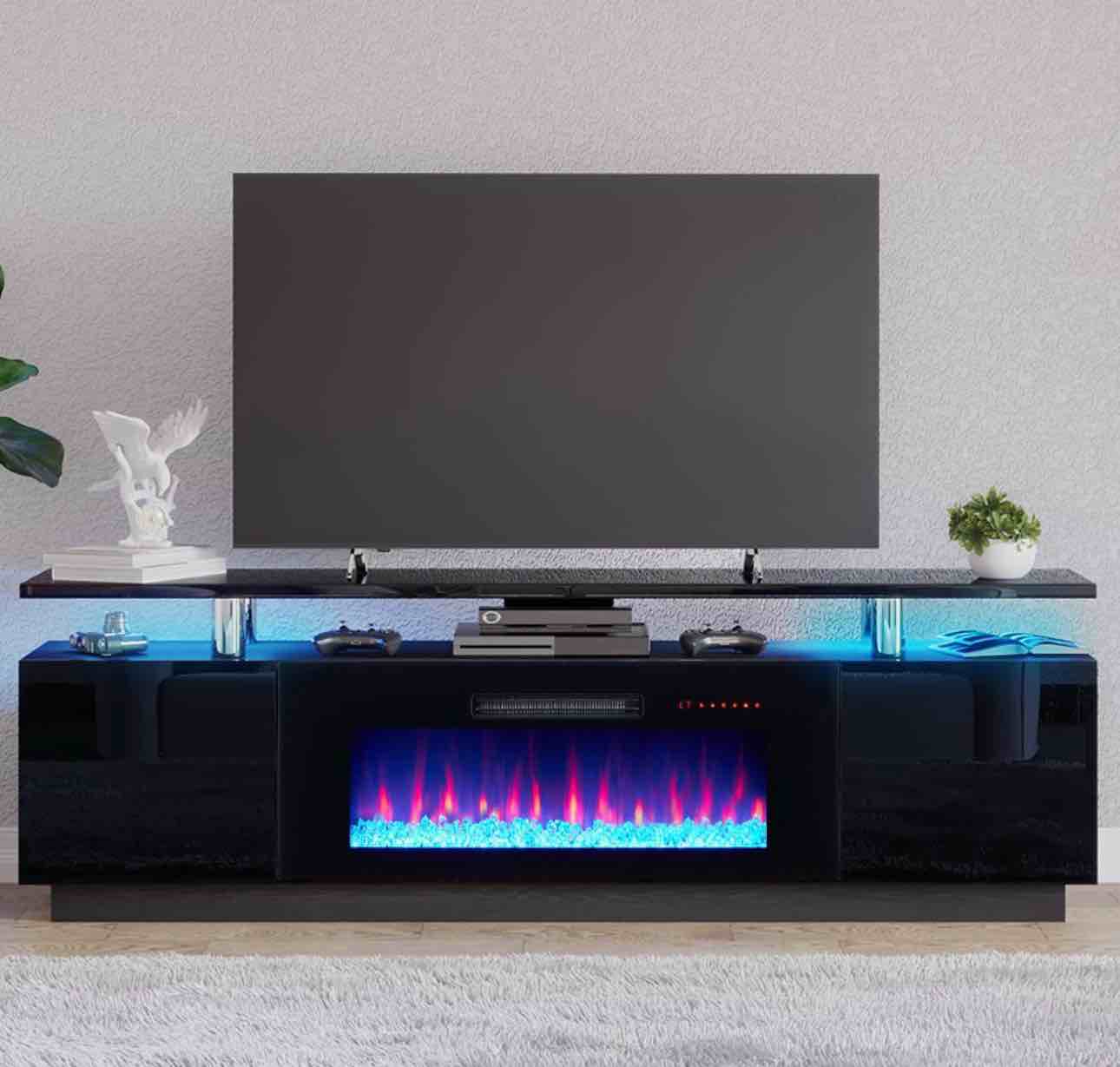 Condition photo showing New/Like New for 2 Tier High Gloss TV Stand with Electric Fireplace Included, Black  By Wade Logan