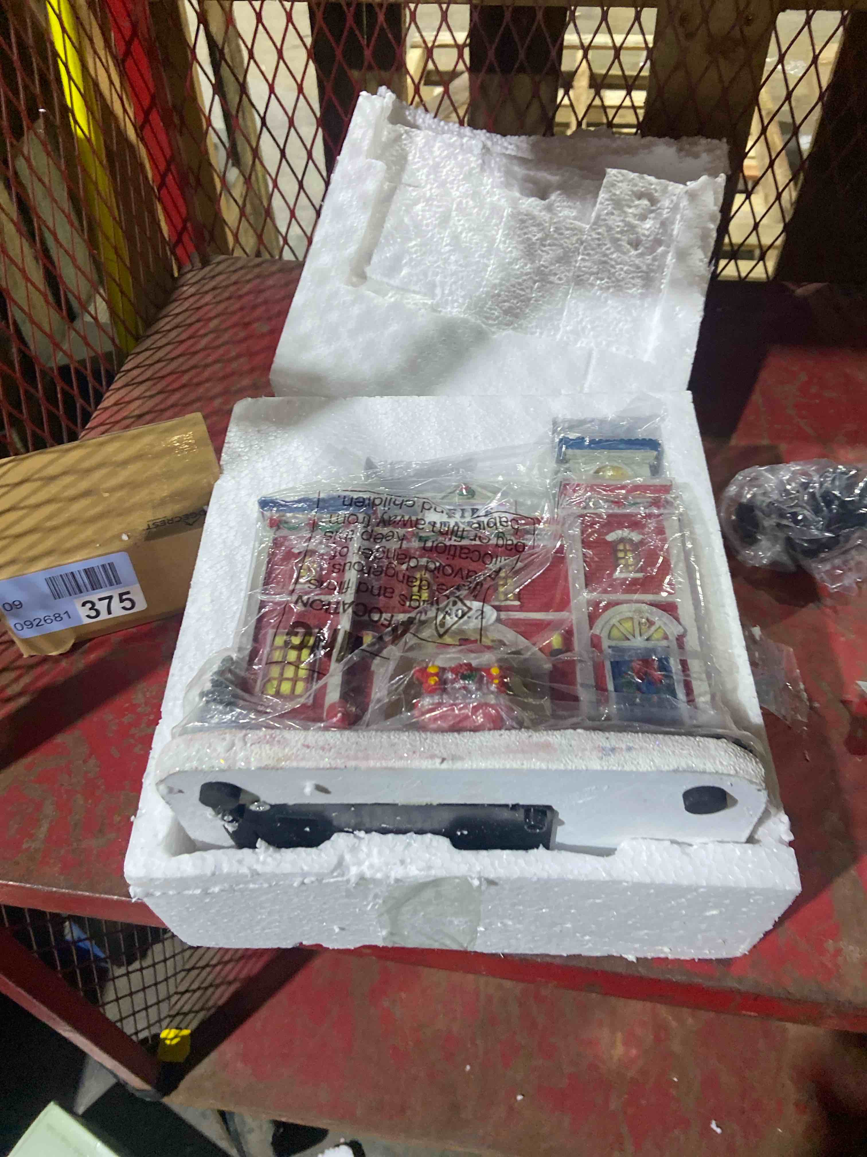 Condition photo showing New/Like New for Christmas Village Animated Fire Station - Pre-lit Musical Snow Village Collectible Building - Perfect Addition to Your Christmas Indoor Decorations & Holiday Displays - Made of Resin (Moving Truck)