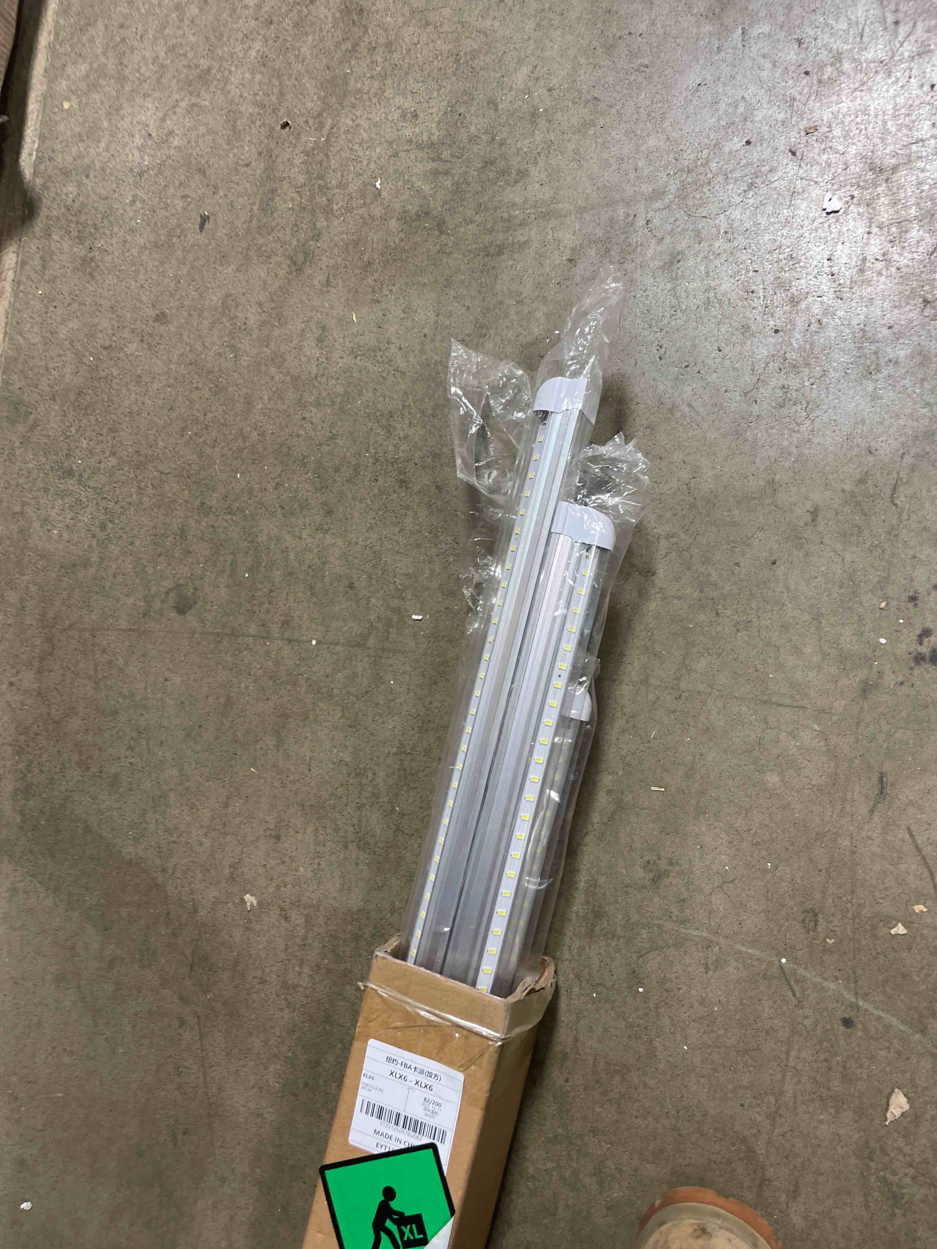 Condition photo showing New/Like New for (Pack of 4) Linkable LED Utility Shop Lights for Garage, 6FT, 60W, LED Tube Ceiling Light T8 Integrated Single Fixture, 6000K, 8000LM Daylight V Shape, Basement, Offices, Clear Lens, Plug and Play