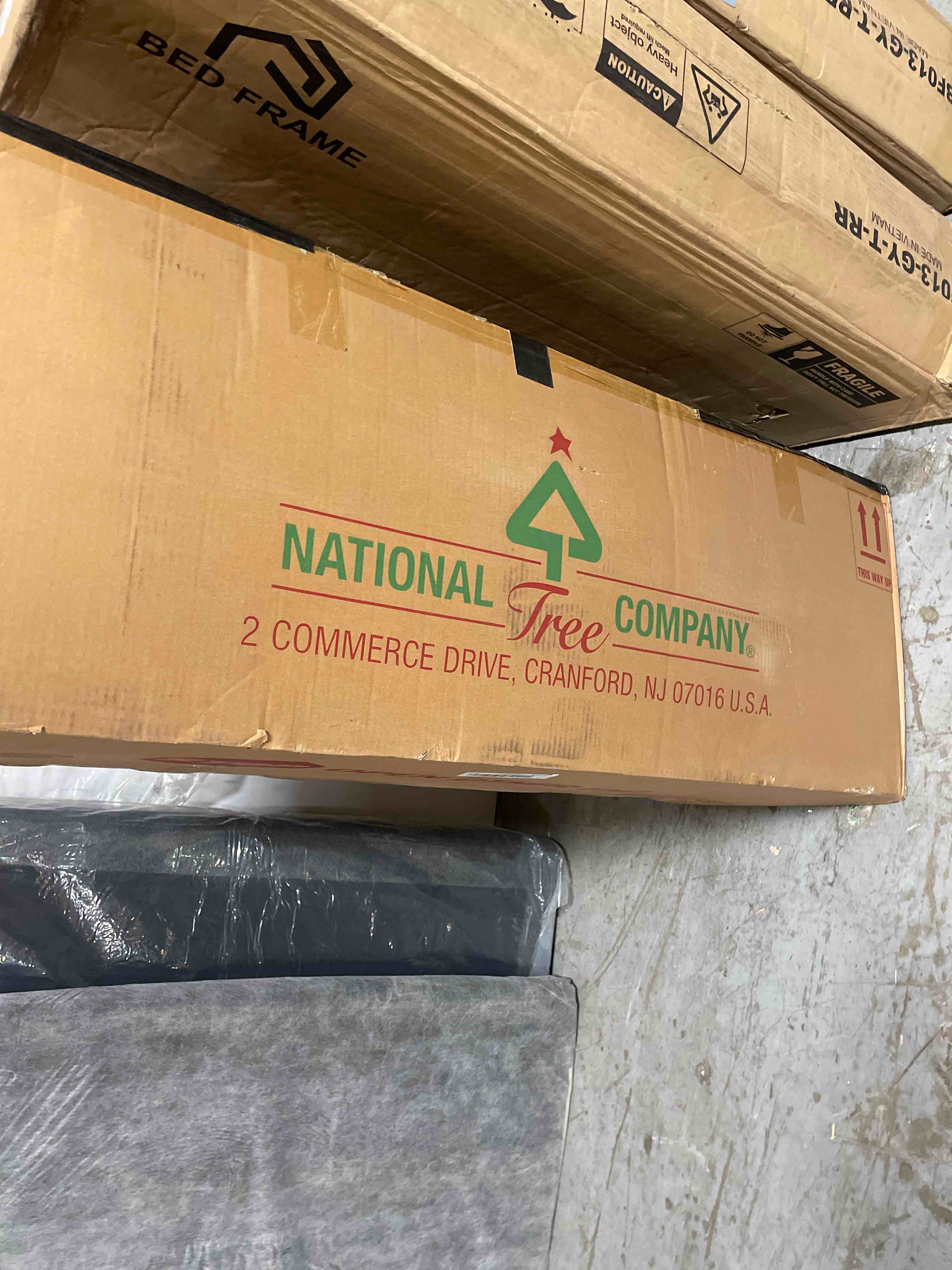 Condition photo showing Good Condition for National Tree Company Pre-Lit 'Feel Real' Artificial Full Downswept Christmas Tree, Green, Douglas Fir, Dual Color LED Lights, 7.5 feet (used)