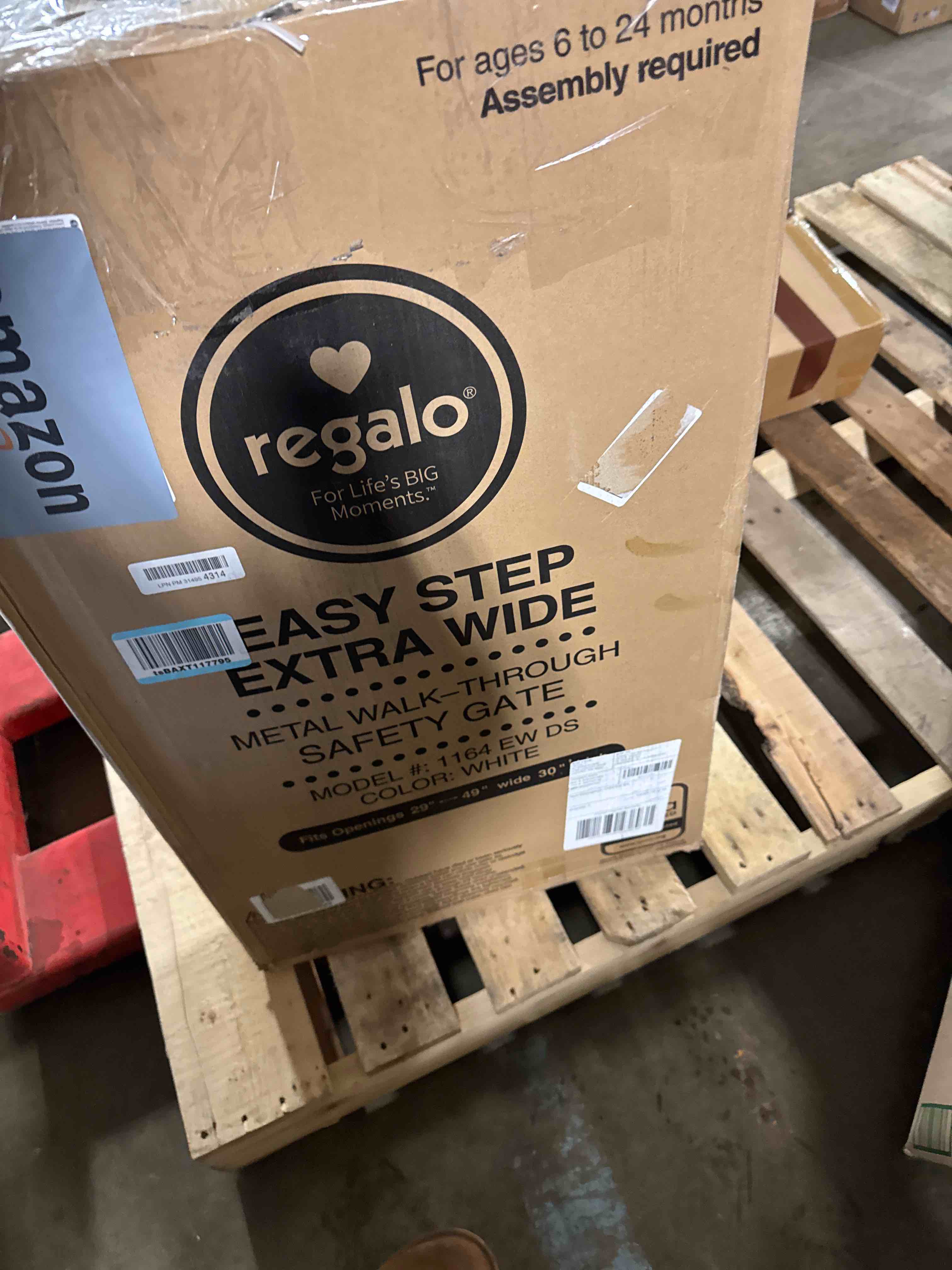 Condition photo showing New/Like New for Regalo Easy Step Extra Tall Walk Thru Baby Gate, Bonus Kit, Includes 4-Inch Extension Kit, 4 Pack of Pressure Mount Kit and 4 Pack of Wall Cups and Mounting Kit, Black Black 29-36.5"W x 36"H