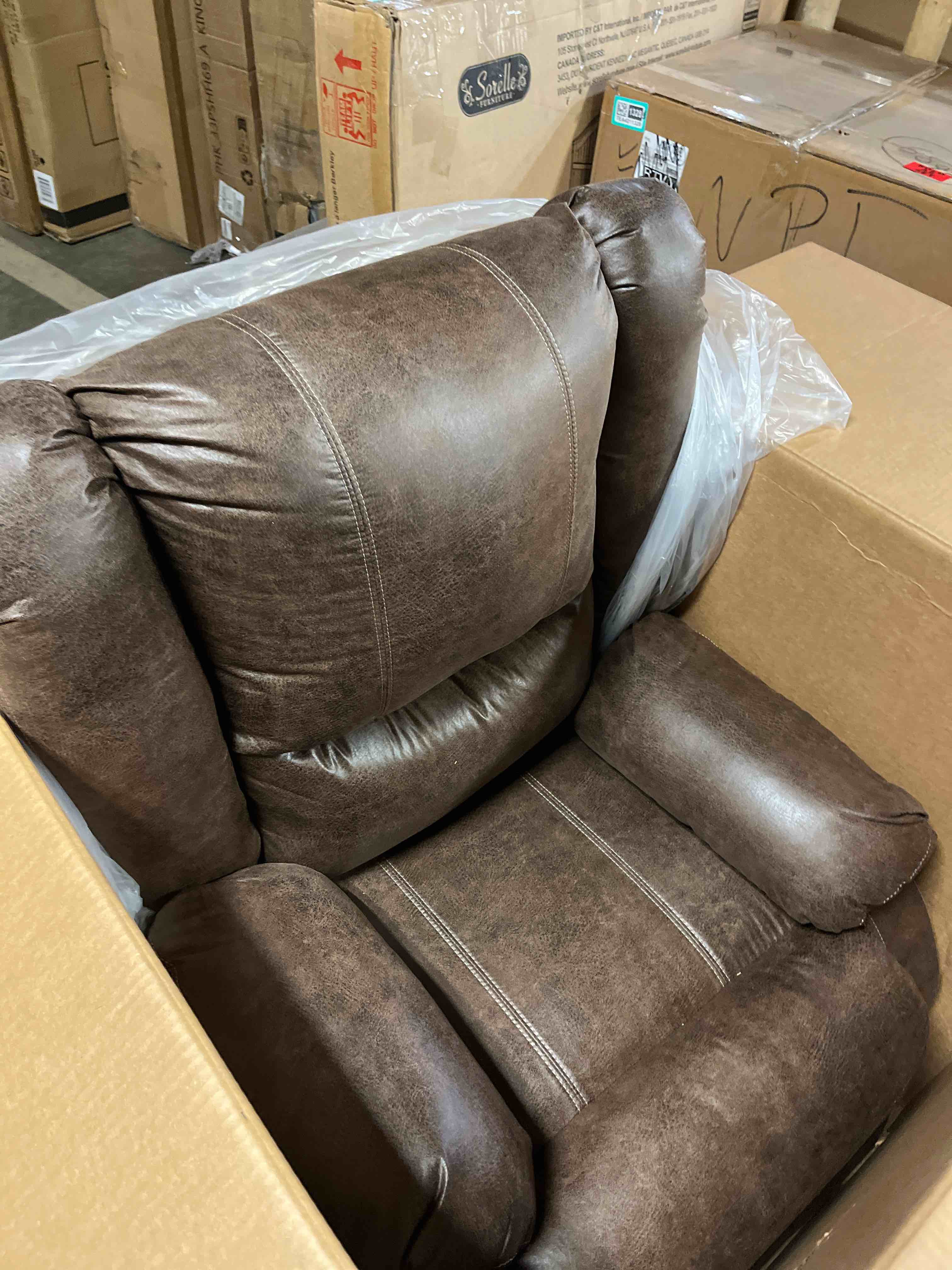 Condition photo showing New/Like New for Signature Design by Ashley Bladewood Faux Leather Pebble Manual Zero Wall Recliner, Brown