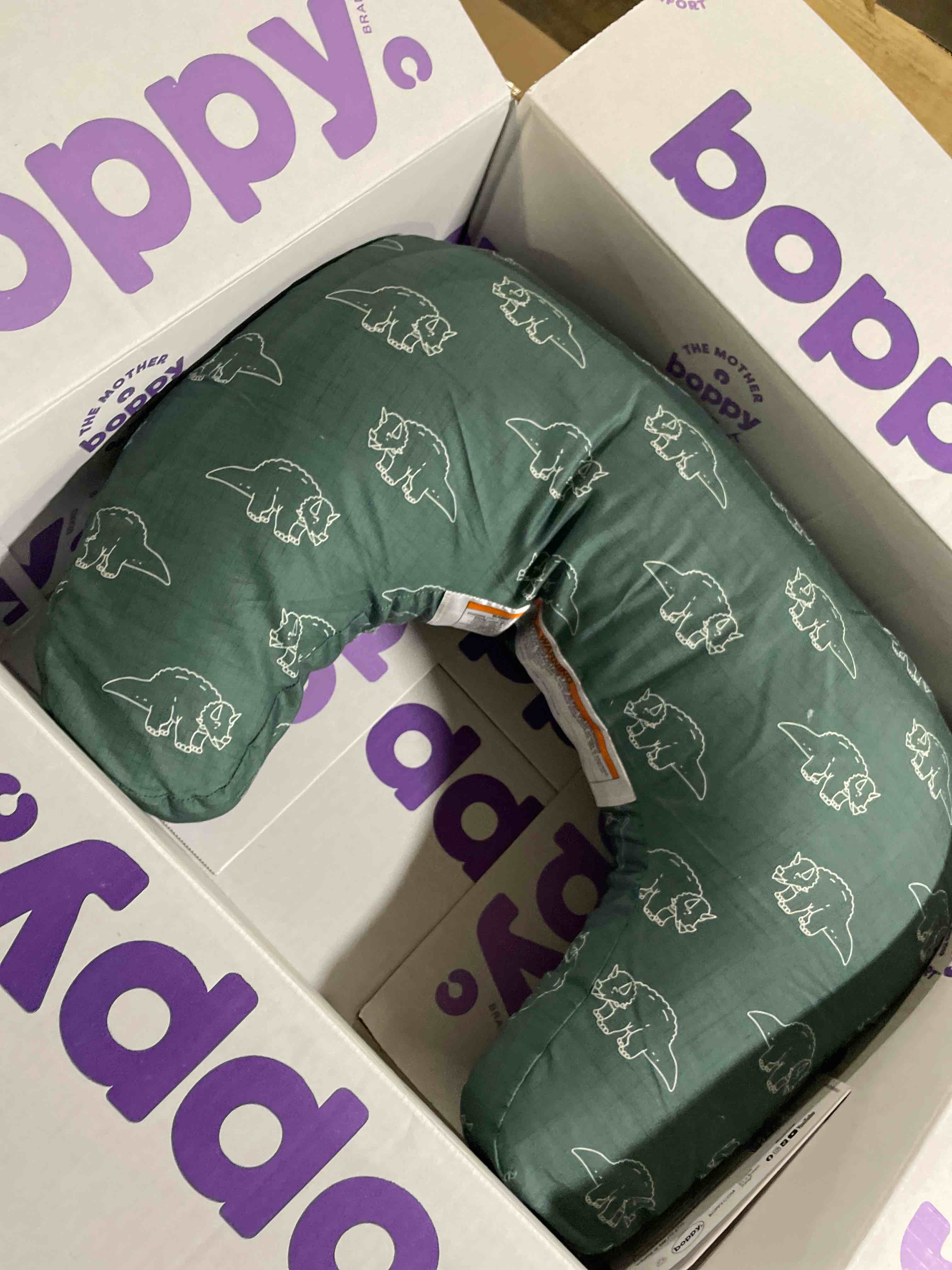 Condition photo showing New/Like New for Boppy Nursing Pillow - Firm, Ergonomic U-Shaped Bottle and Breastfeeding Pillow with High Lift for Comfort and Support, Spacious Surface - Forest Green Dinos New Nursing Pillow Forest Green Dinos