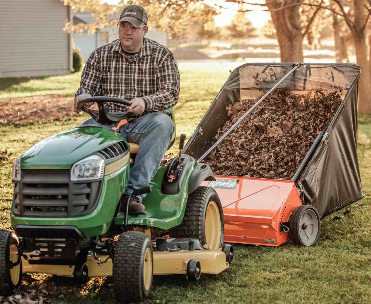 agri-fab 44 in tow-behind lawn sweeper with 28 cu ft flow-through hopper bag, adjustable brush height, and dump from seat handle