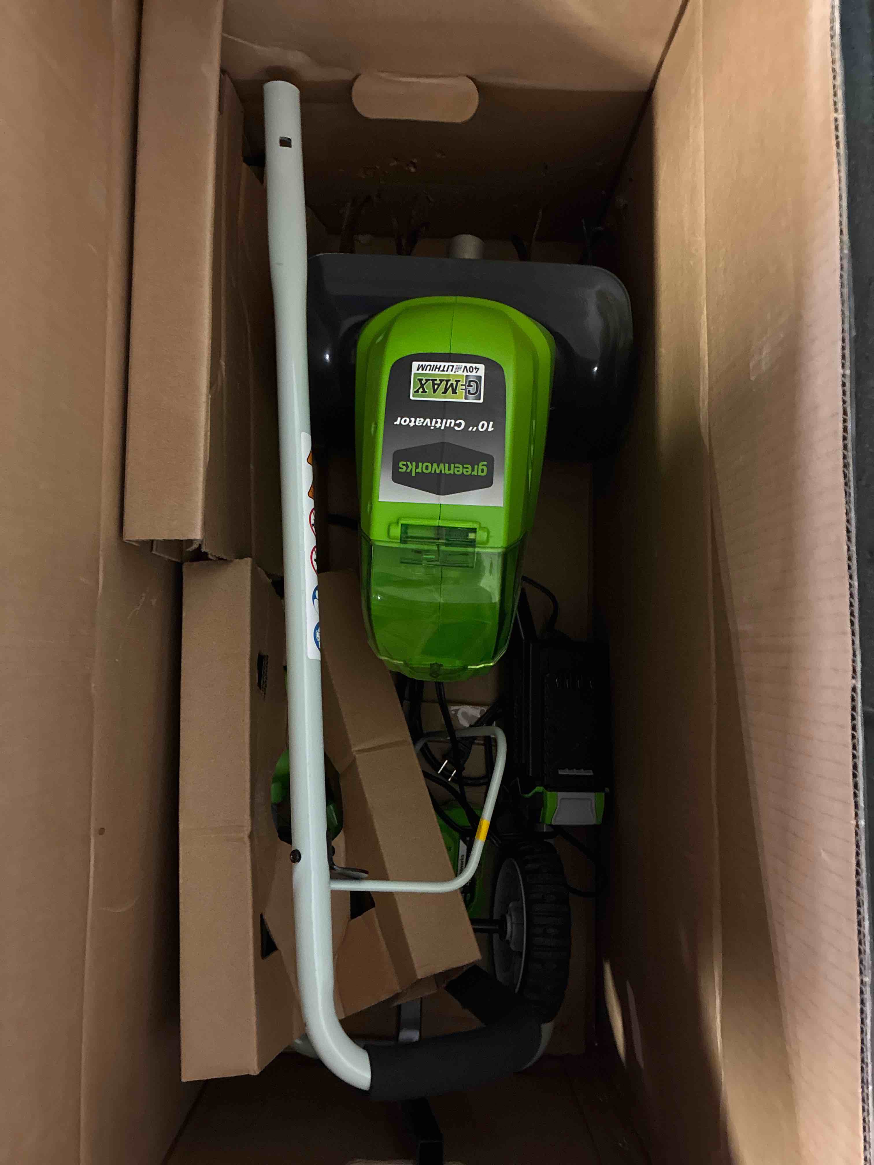 Condition photo showing New/Like New for greenworks 40v 10" cordless tiller / cultivator, 4.0ah battery and charger included, green