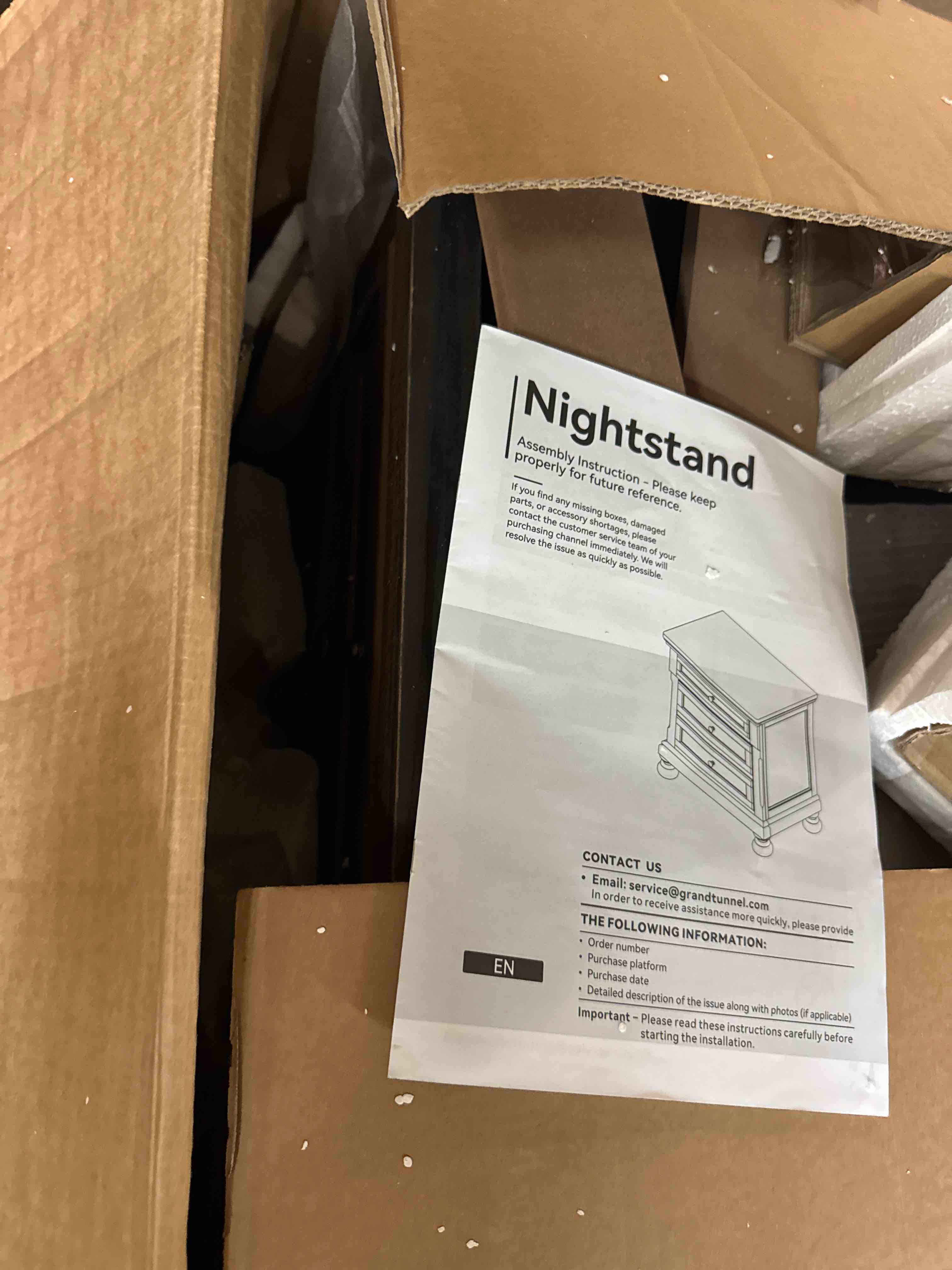 Condition photo showing New/Like New for signature design by ashley glarrison classic 3-drawer nightstand with felt-lined top drawer and pull-out tray, poplar wood, pine veneer, metal knobs with pewter-tone finish, 29.88" high, light brown