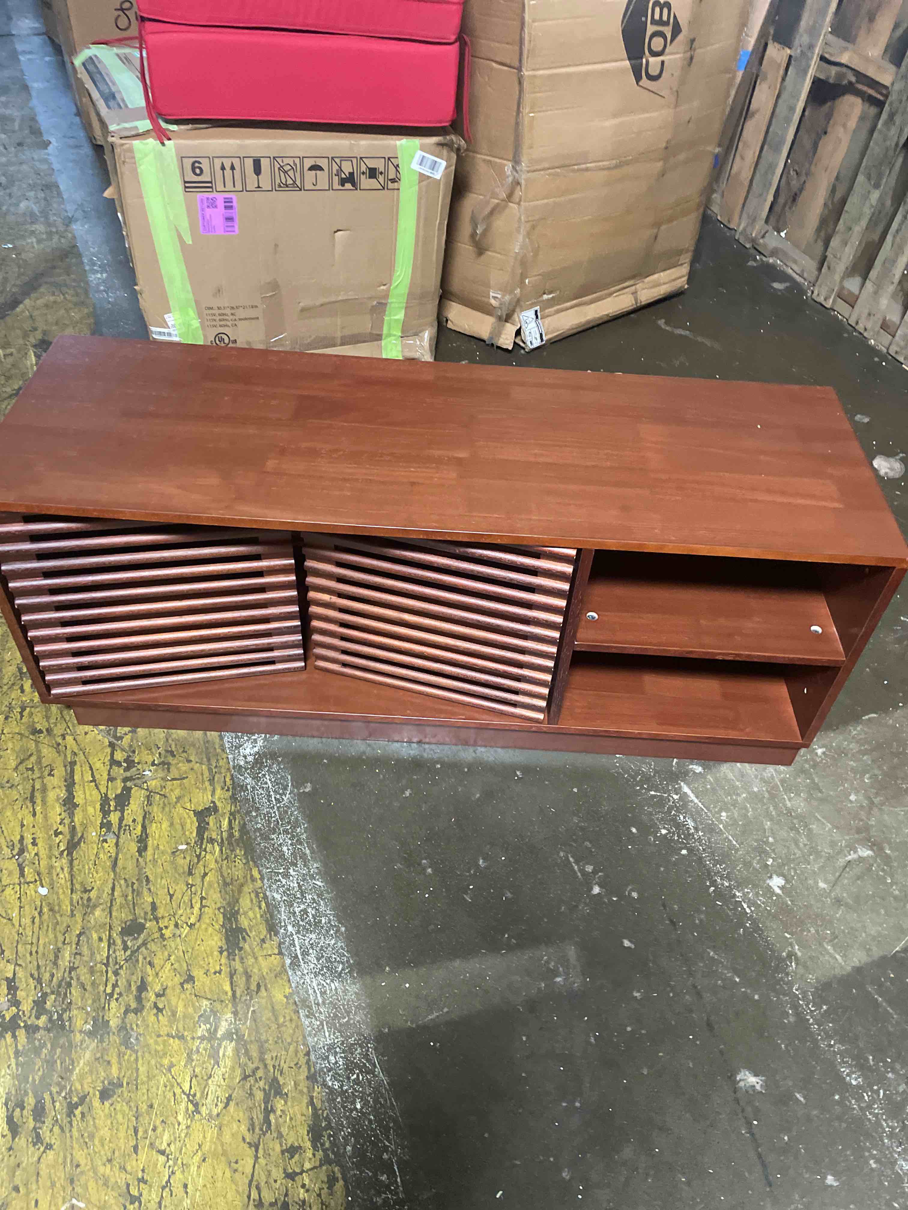 Condition photo showing As Is for safavieh aricia tv stand for up to 65" flatscreen – walnut, 2 sliding doors with interior storage, 1 open shelf, entertainment media console (med9633a)