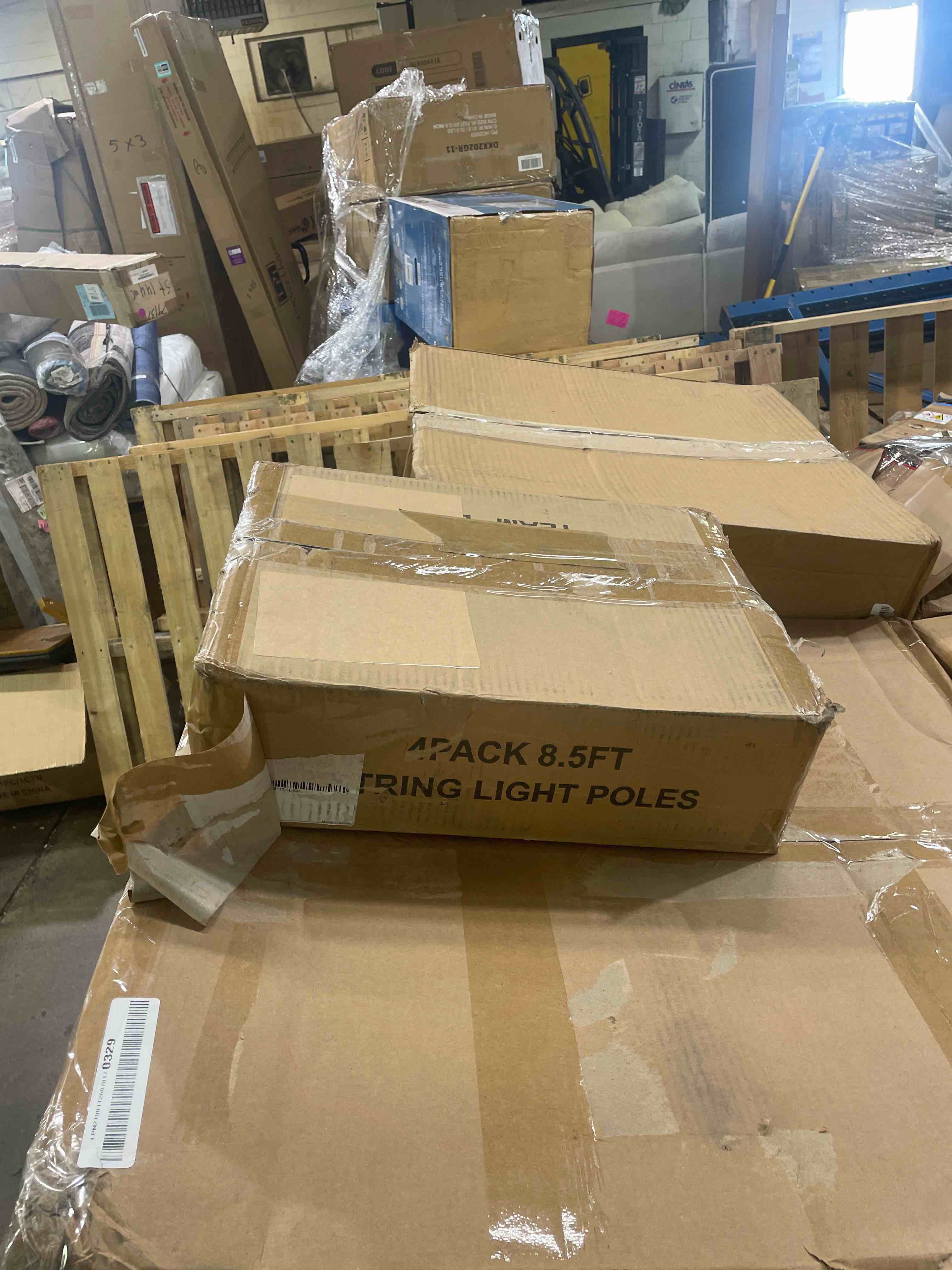 Condition photo showing New/Like New for 8.5 ft. metal outdoor string light poles with hooks and 5-prong base in black (4-pack)