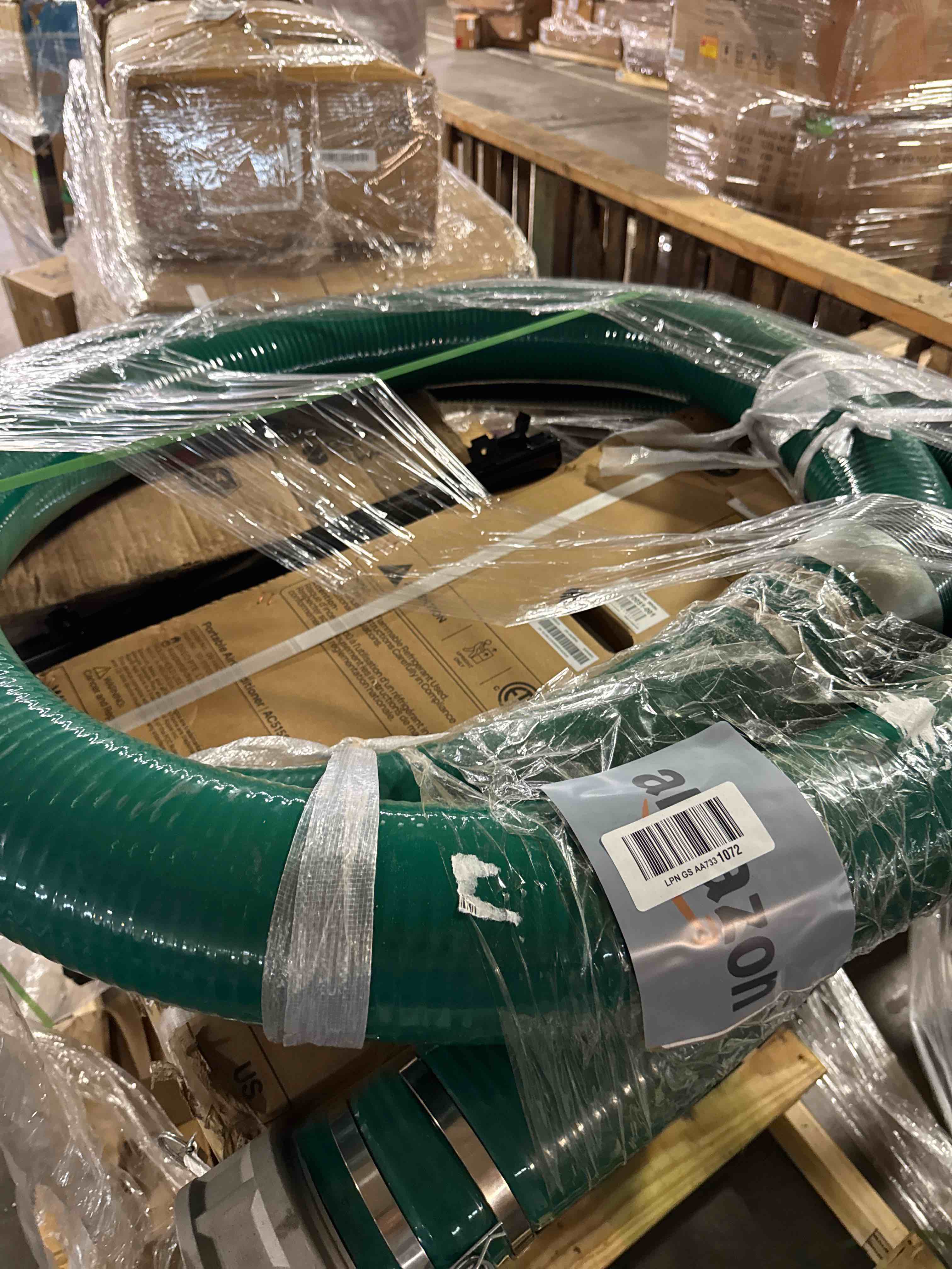 Condition photo showing New/Like New for gloxco heavy duty green pvc suction hose assembly for water transfer, 2" inside diameter, installed male x female cam and groove fittings, 20 ft length