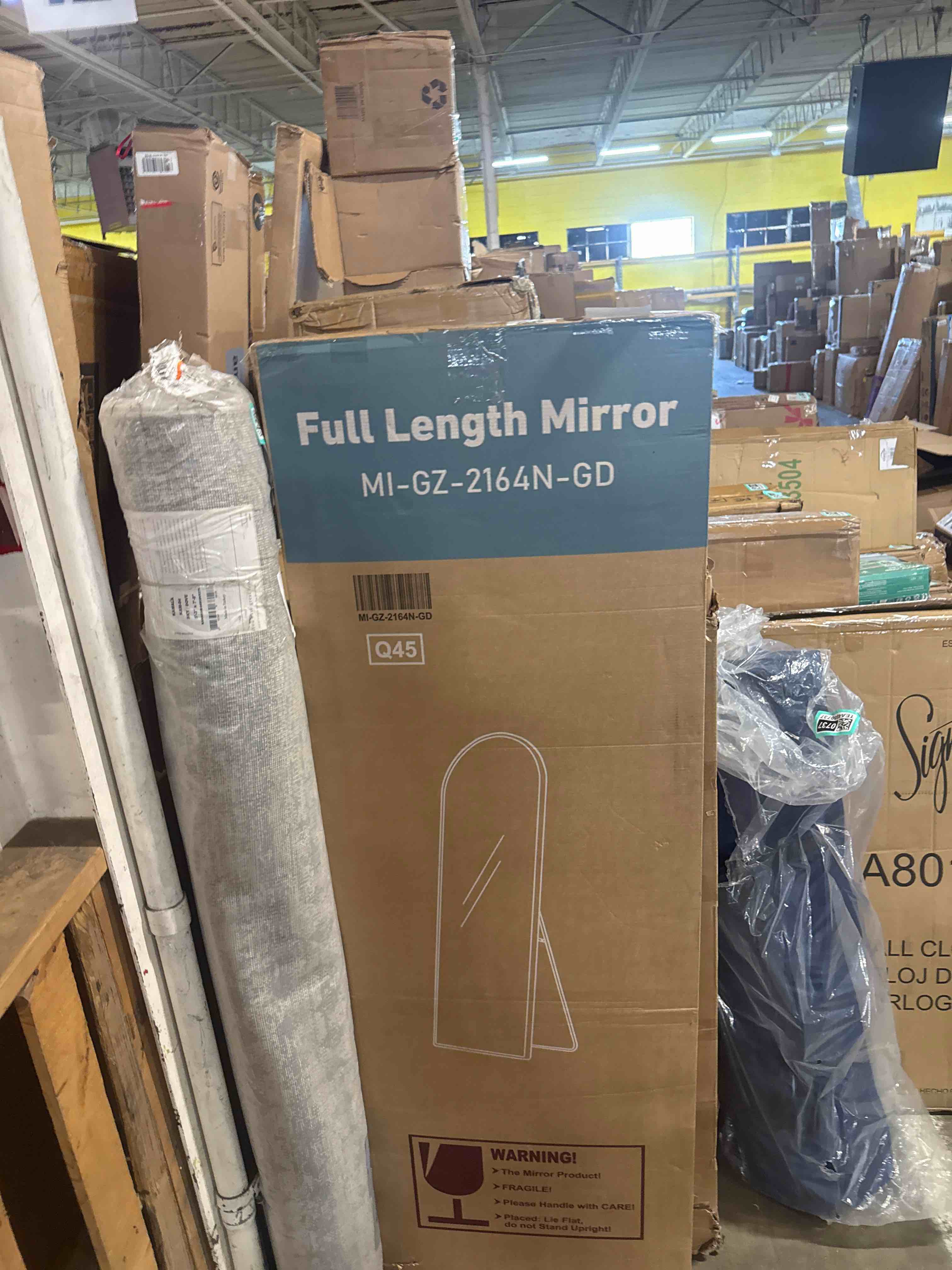 Condition photo showing New/Like New for 21 in. w x 64 in. h aluminium alloy frame gold arched floor mirror with floor stand and wall mounted hooks