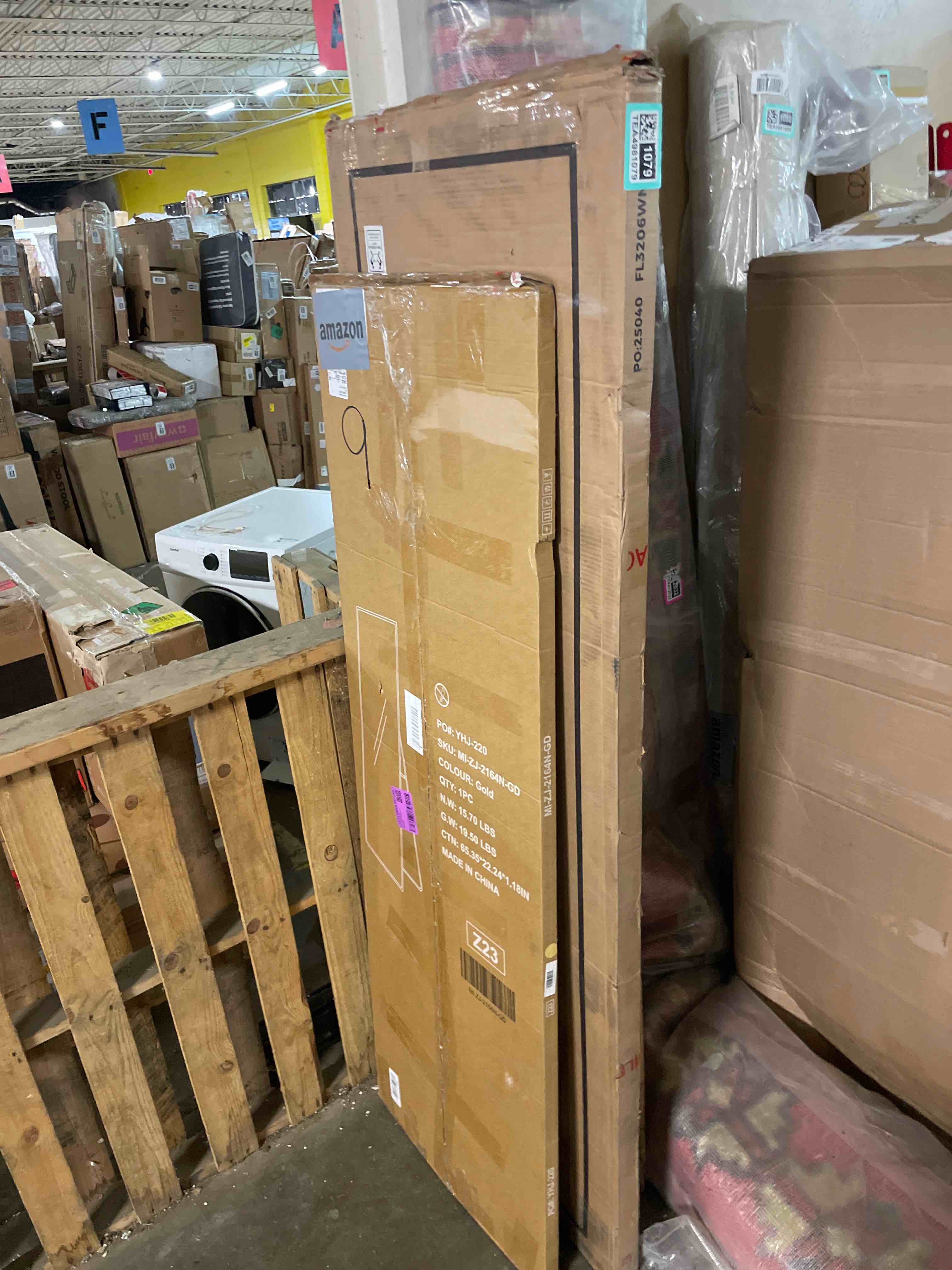 Condition photo showing New/Like New for 21 in. w x 64 in. h aluminum alloy frame gold full body floor mirror with floor stand and wall mounted hooks