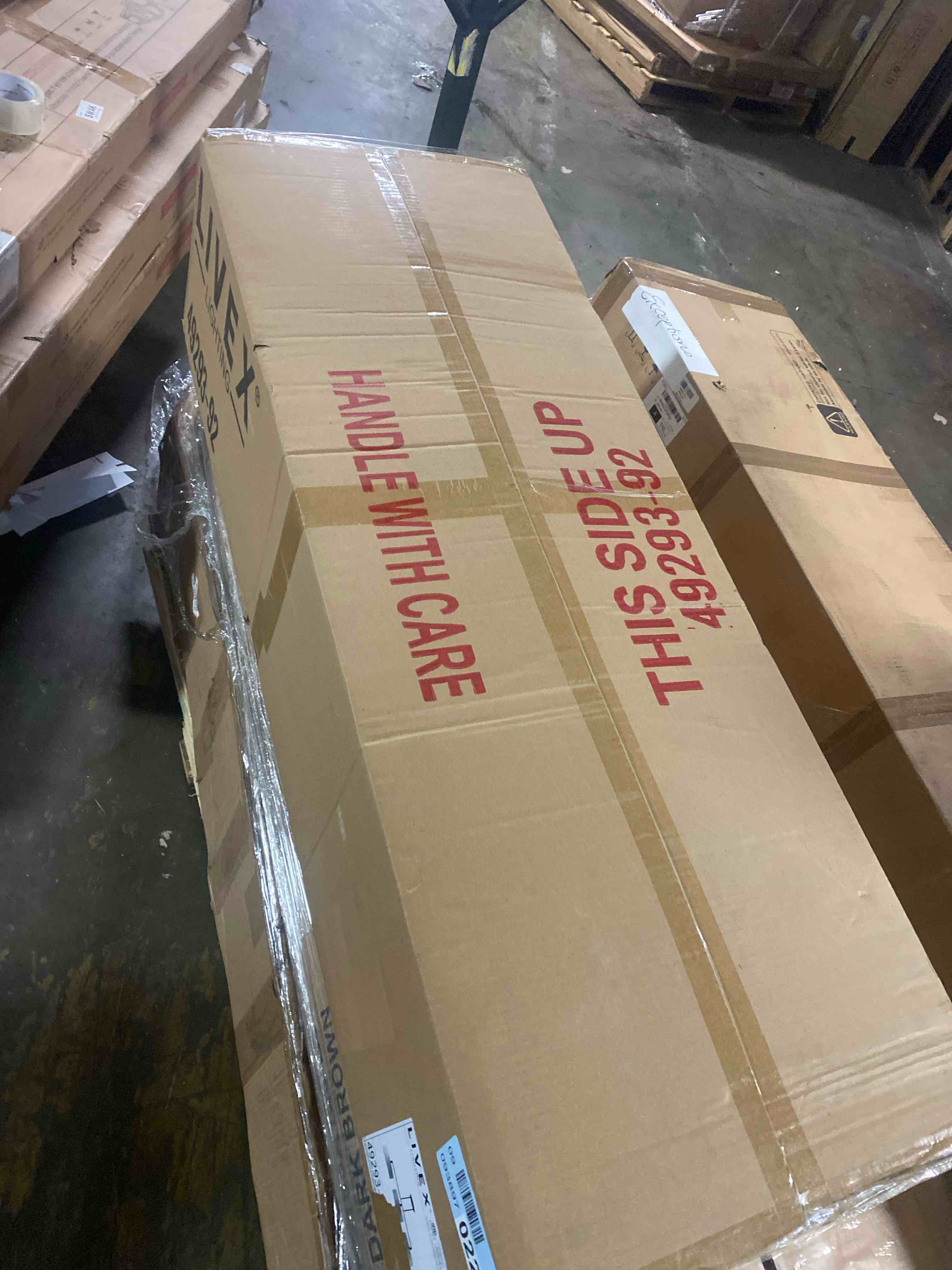 Condition photo showing New/Like New for livex lighting 45493-46 meridian 3 light 51 inch black chrome linear chandelier ceiling light