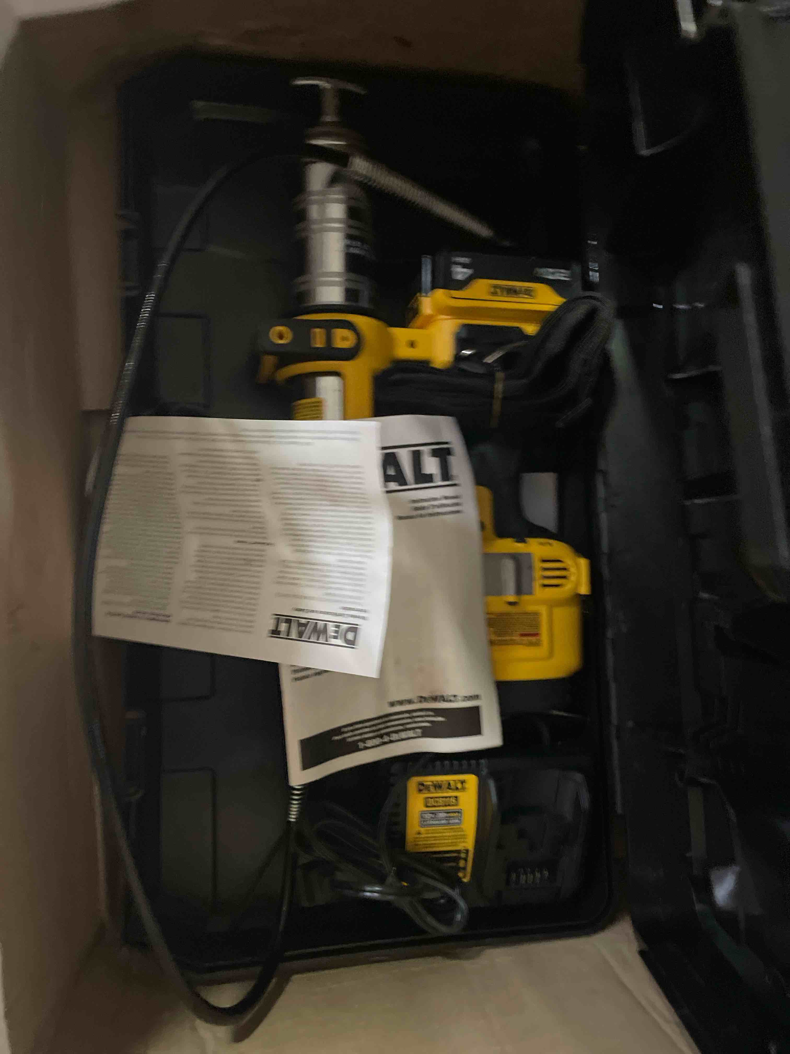 Condition photo showing New/Like New for dewalt grease gun kit 20v max with 4.0ah battery and charger, cordless grease gun, led light, 42” hose, 10,000 psi, variable speed triggers (dcgg571m1)