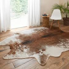 Novelty Dante 6 ft x 7ft Solid Color Handmade Cowhide 6' x 7' Area Rug in Brown/Cream See More by 17 Stories