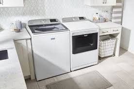 Maytag Top Load Laundry Pair with MVW7232HW 27 inch Top Load Smart Washer and MED7230HW 27 inch Electric Smart Dryer in White (TESTED. POWERS ON. SEE PHOTOS.)