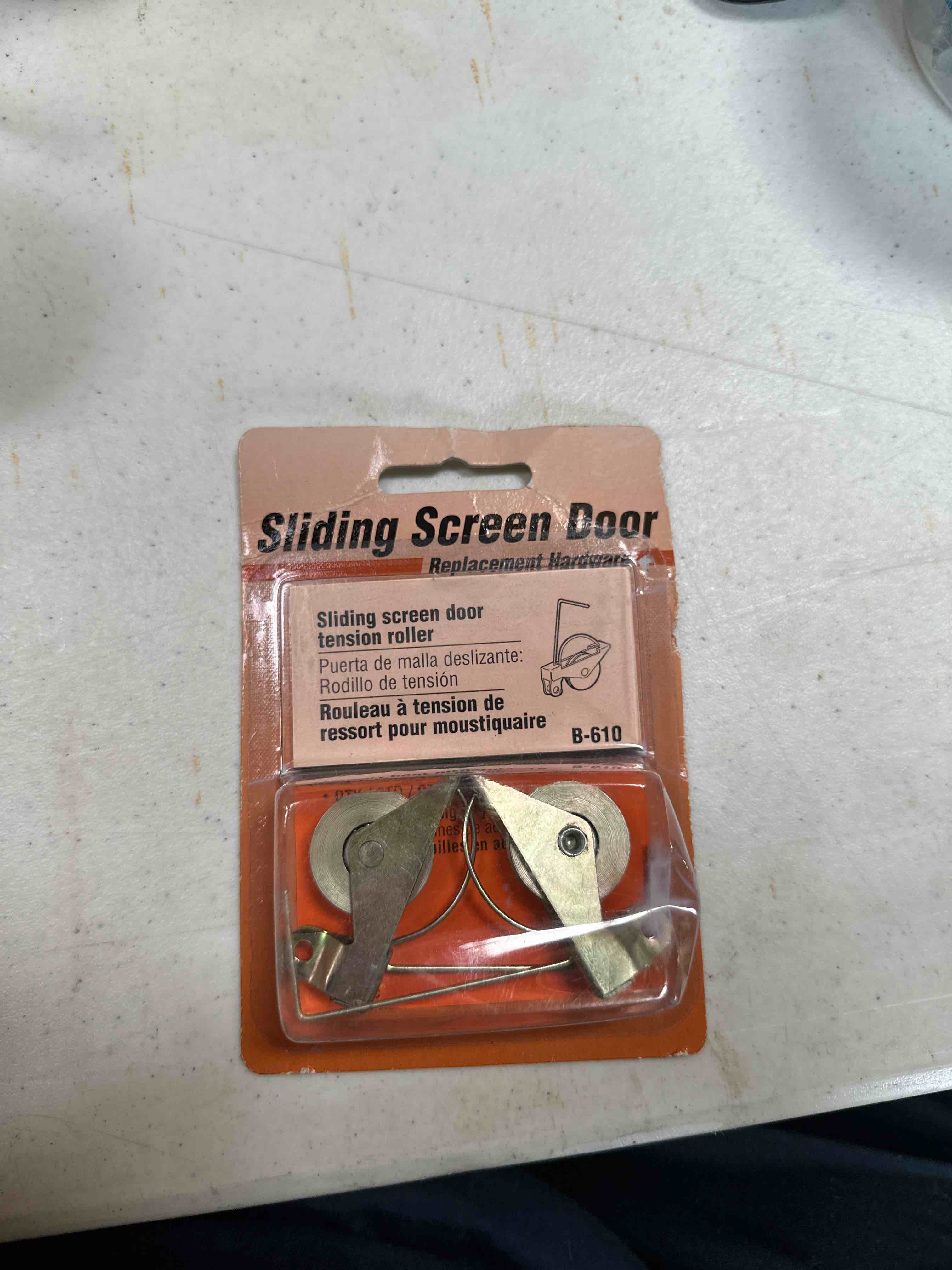 Sliding screen door tension roller 