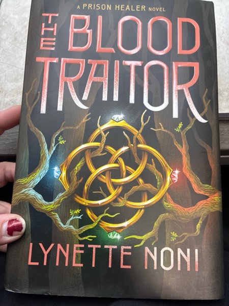 Condition photo showing New/Like New for The Blood Traitor - (The Prison Healer) by Lynette Noni (Hardcover)