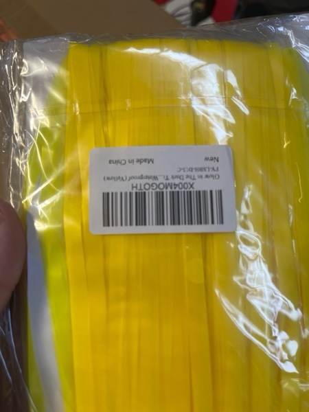 Condition photo showing New/Like New for Glow in The Dark Tinsel Curtains 2 Pack - 3.3x6.6ft UV Reactive ?Fluorescent Party Backdrop for Neon, Birthday, Pride Decorations, Pre-Taped, Lightweight Waterproof (Yellow)