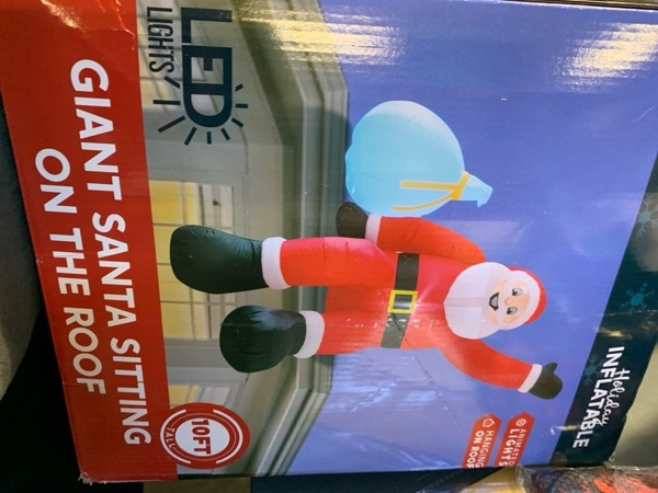 Condition photo showing New/Like New for JOIEDOMI 10 FT Christmas Inflatables Santa with Gift Bags Outdoor Decorations, Blow Up Giant Santa Sitting on The Roof with Build-in Color Changing LEDs for Xmas Party Decor Yard Garden Holiday Decor